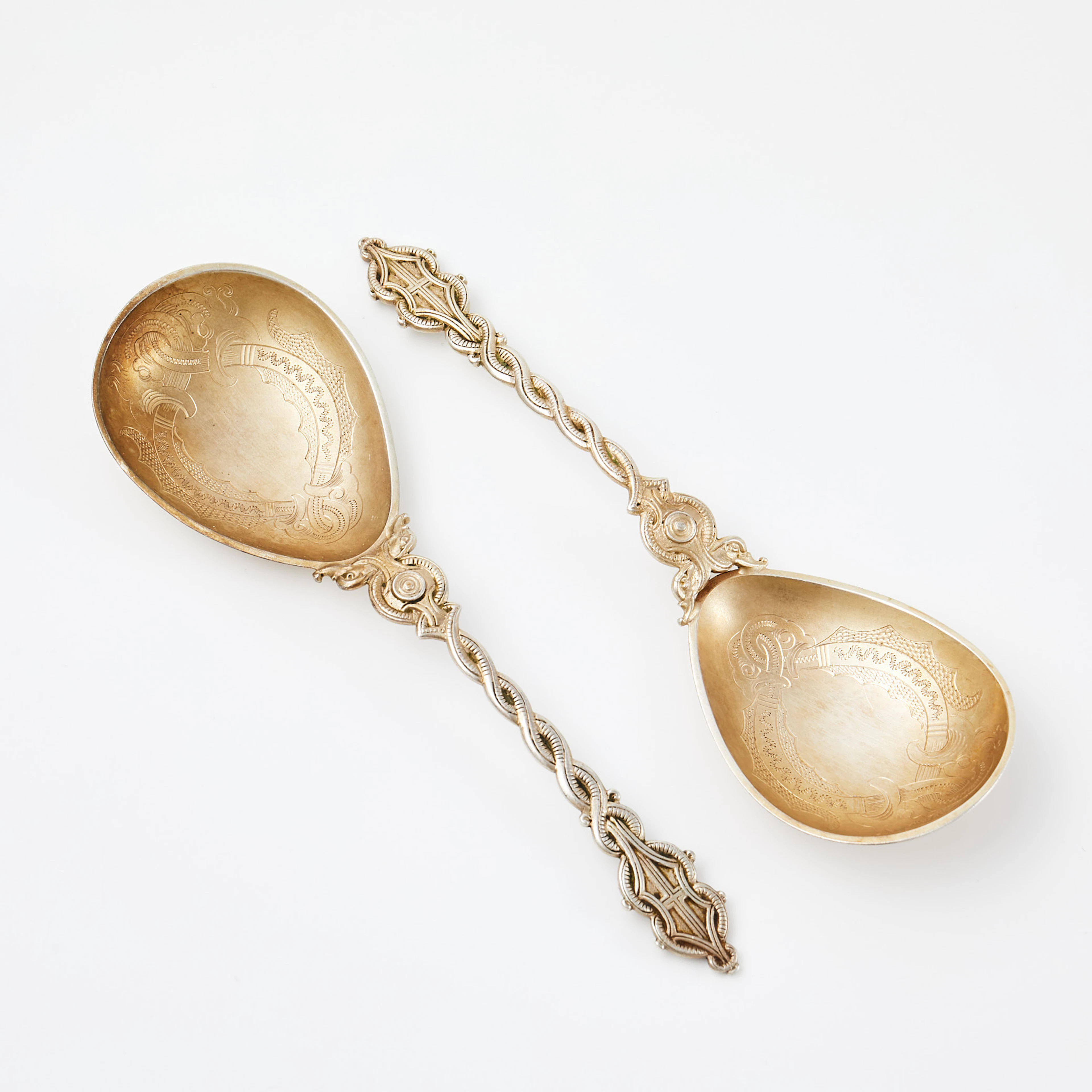 LAURITS BERTH (1857-1917). Skedar, 2 st, silver, ciselerad dekor
