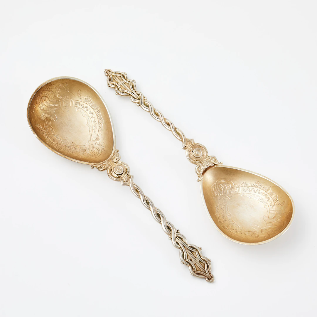 LAURITS BERTH (1857-1917). Skedar, 2 st, silver, ciselerad dekor