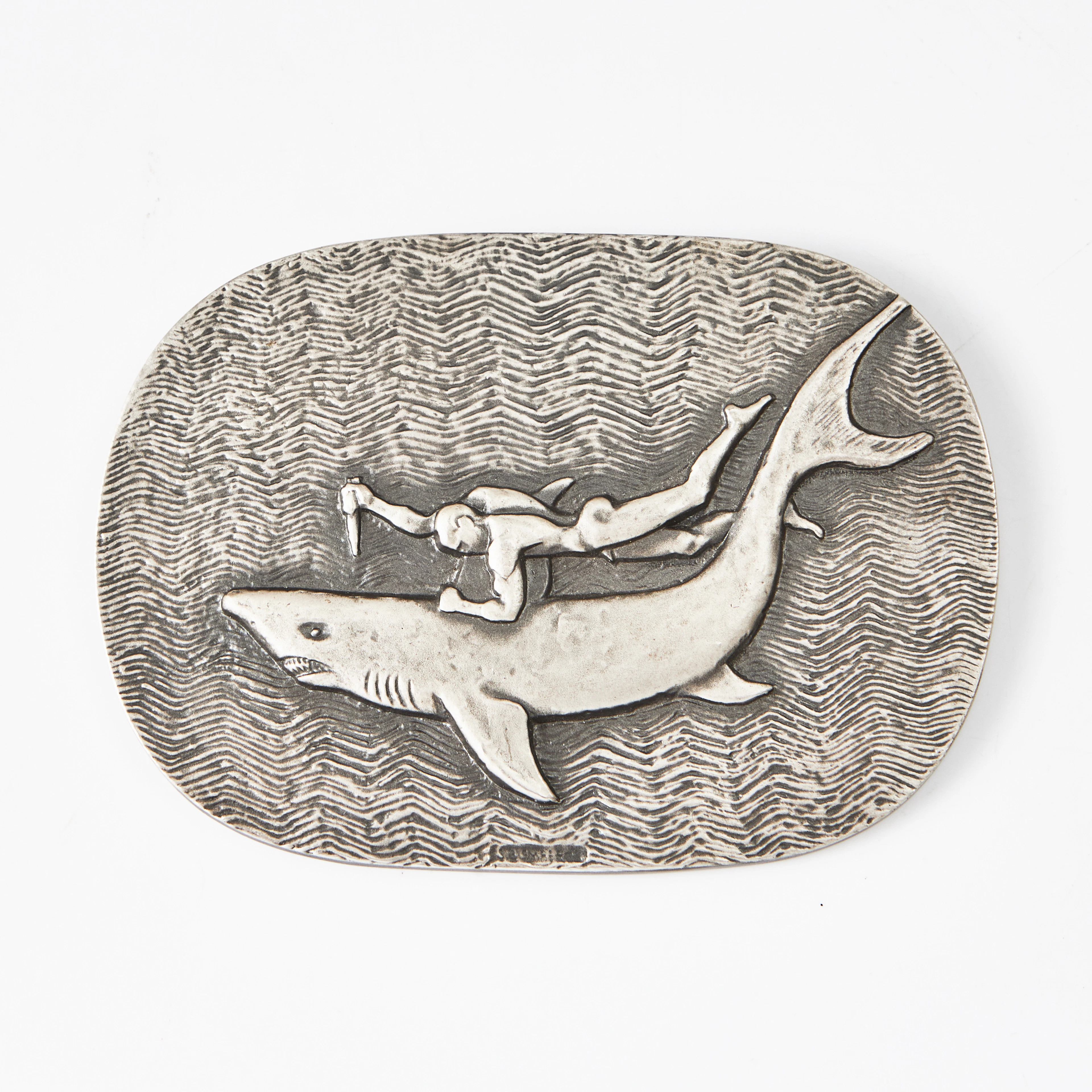 STIG BLOMBERG. "Hajdödaren", plakett, metall, stämpelmärkt.