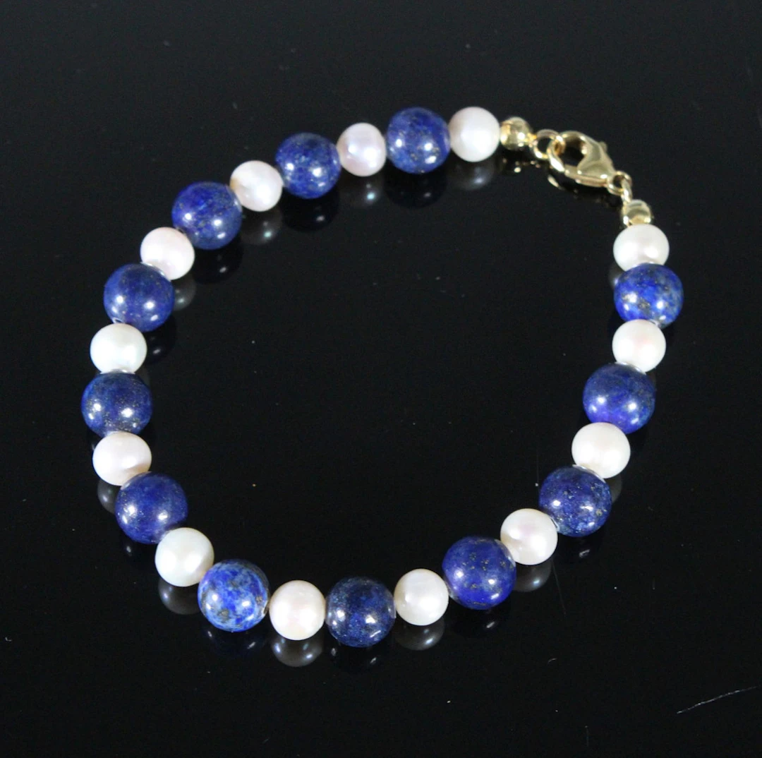 Armband mit SWZP und Lapis Lazuli, 375er Gelbgold.