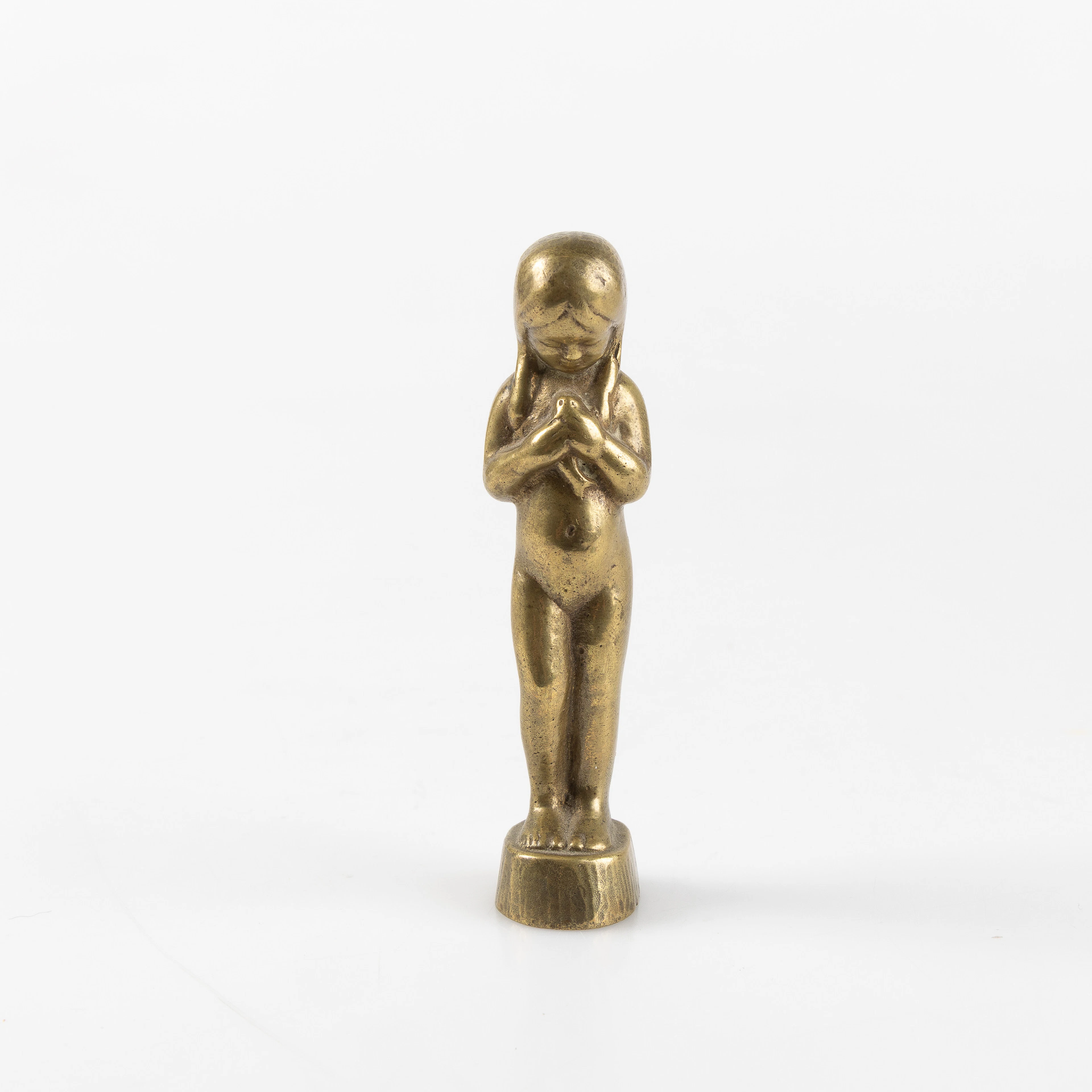 ASTRI BERGMAN-TAUBE. Skulptur / sigillstamp, flicka, Herman Bergman, brons.