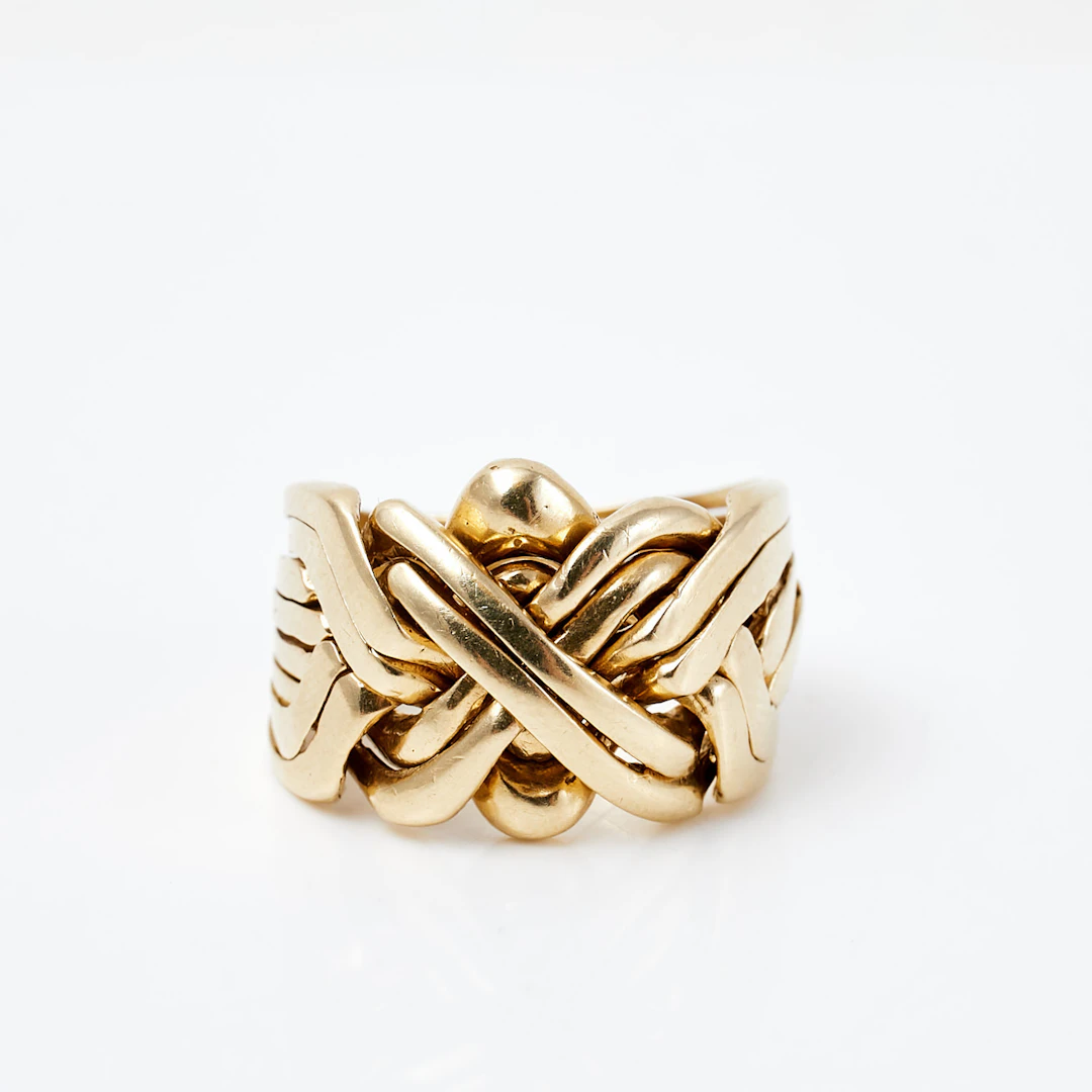 RING, 14 k guld, flätad pusselring, utländska stämplar.