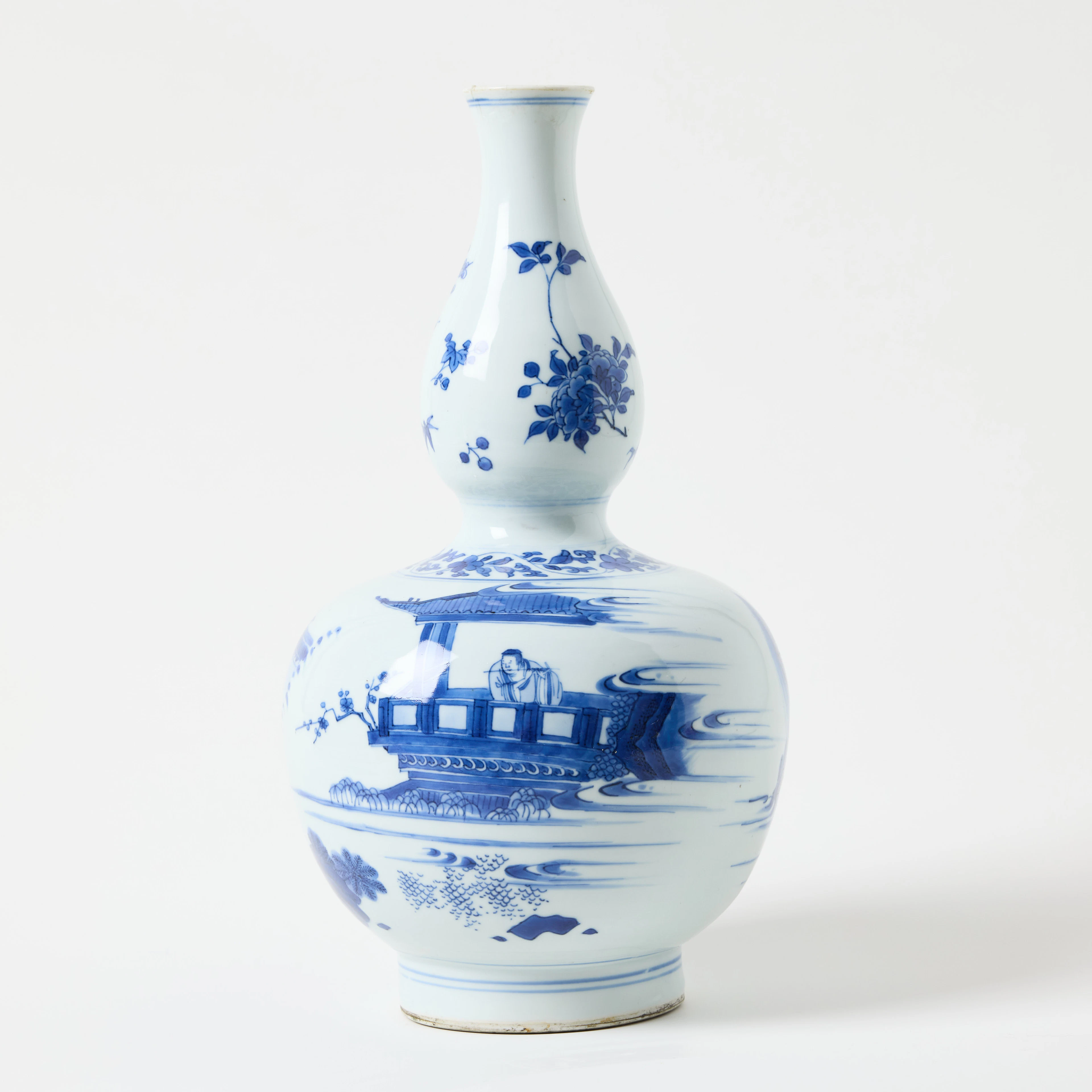 A Chinese Transitional Blue and White Double Gourd Vase.