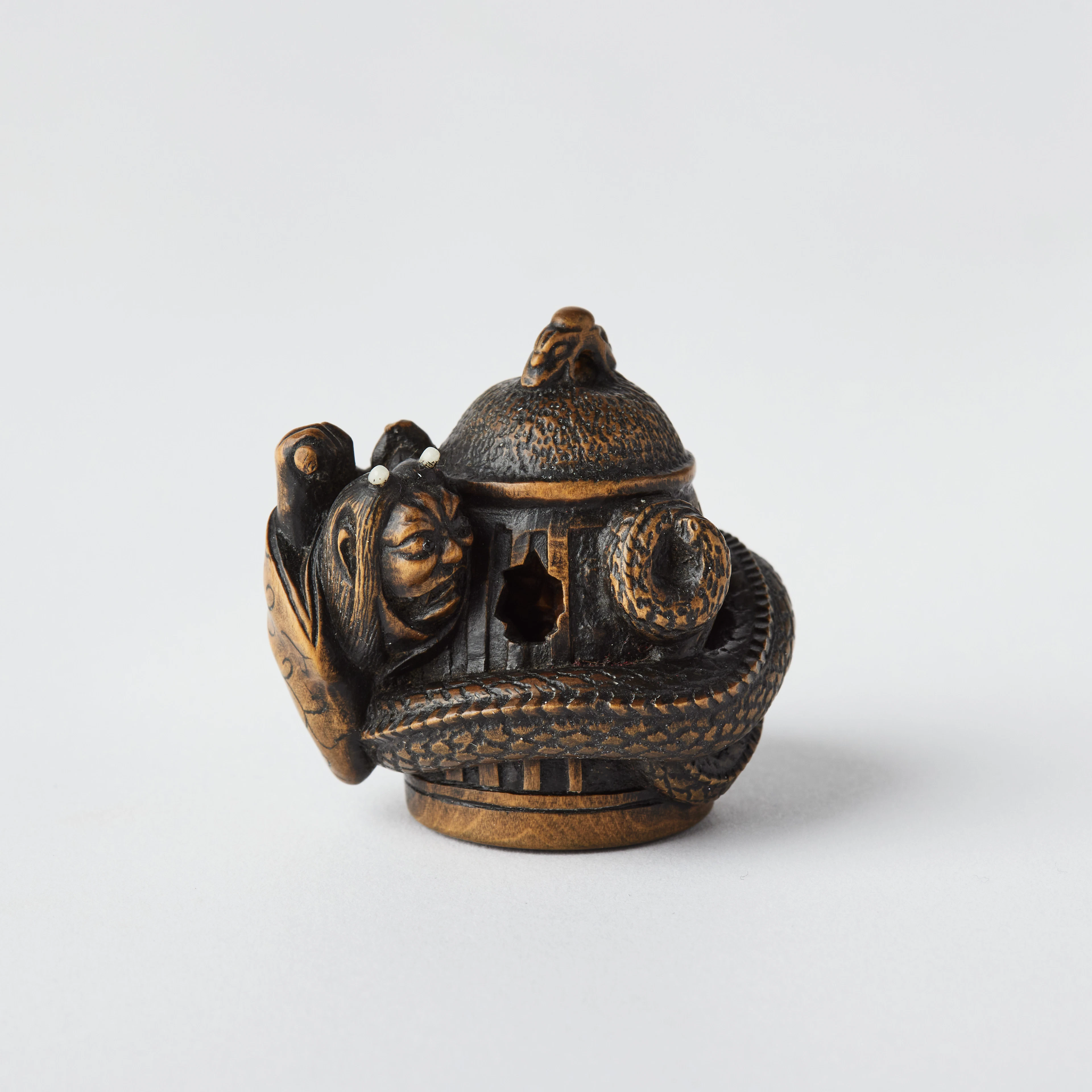 A Japanese Wood Netsuke of Kiyohime by Masanao Shinzan (1904-1982).