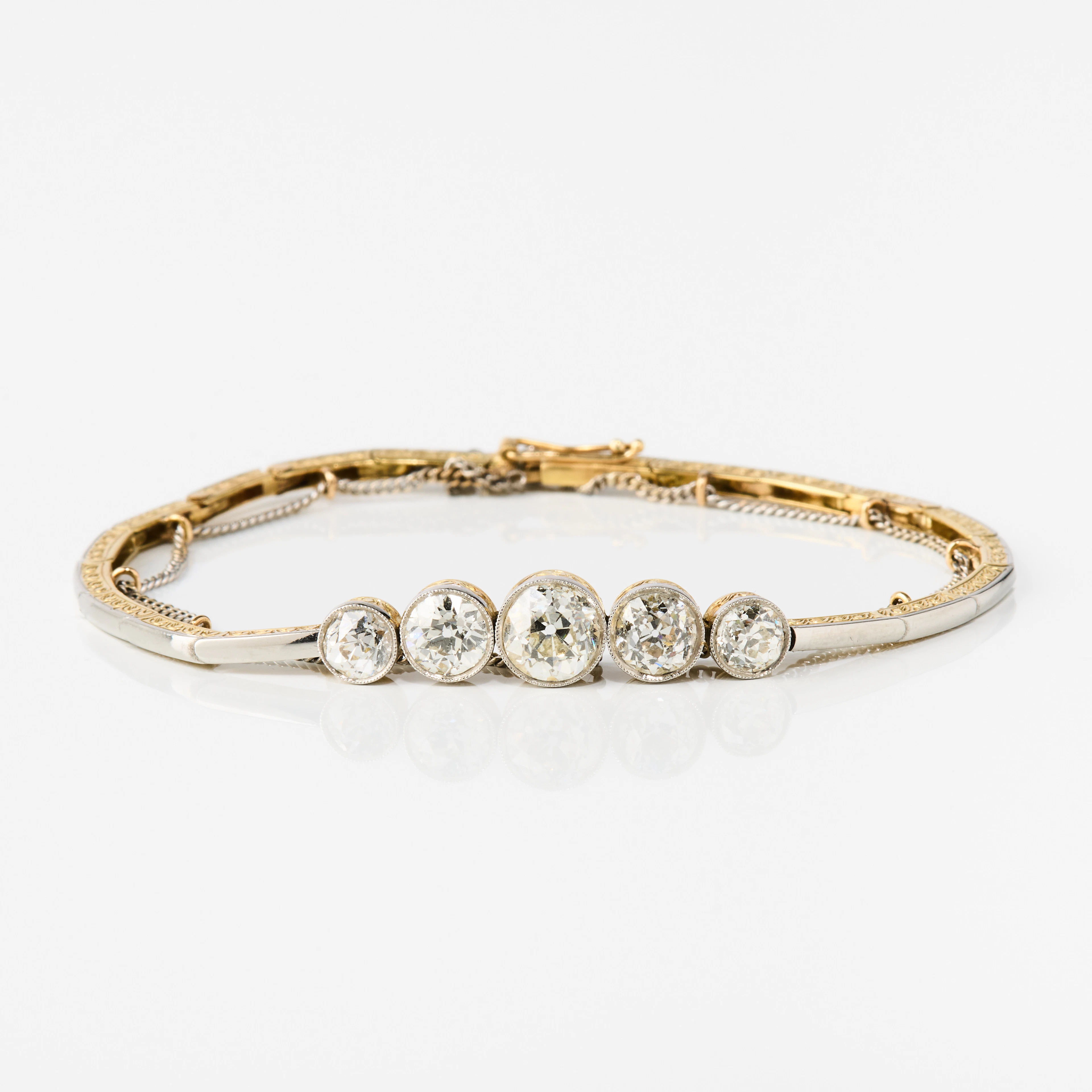 ARMBAND, 18K guld, platina och diamanter, 1910/20-tal.
