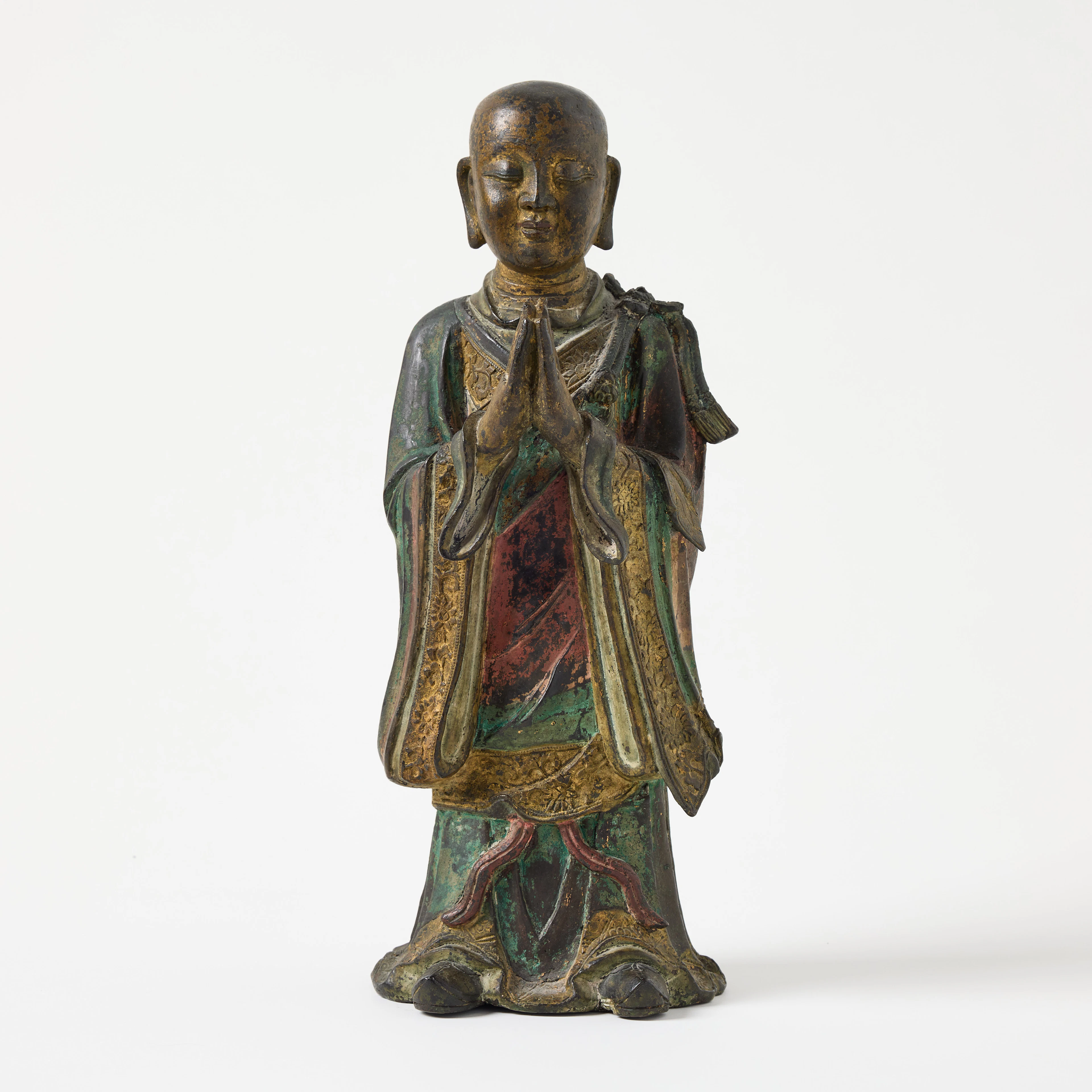 A Chines Ming Bronze Figure of a Lohan.