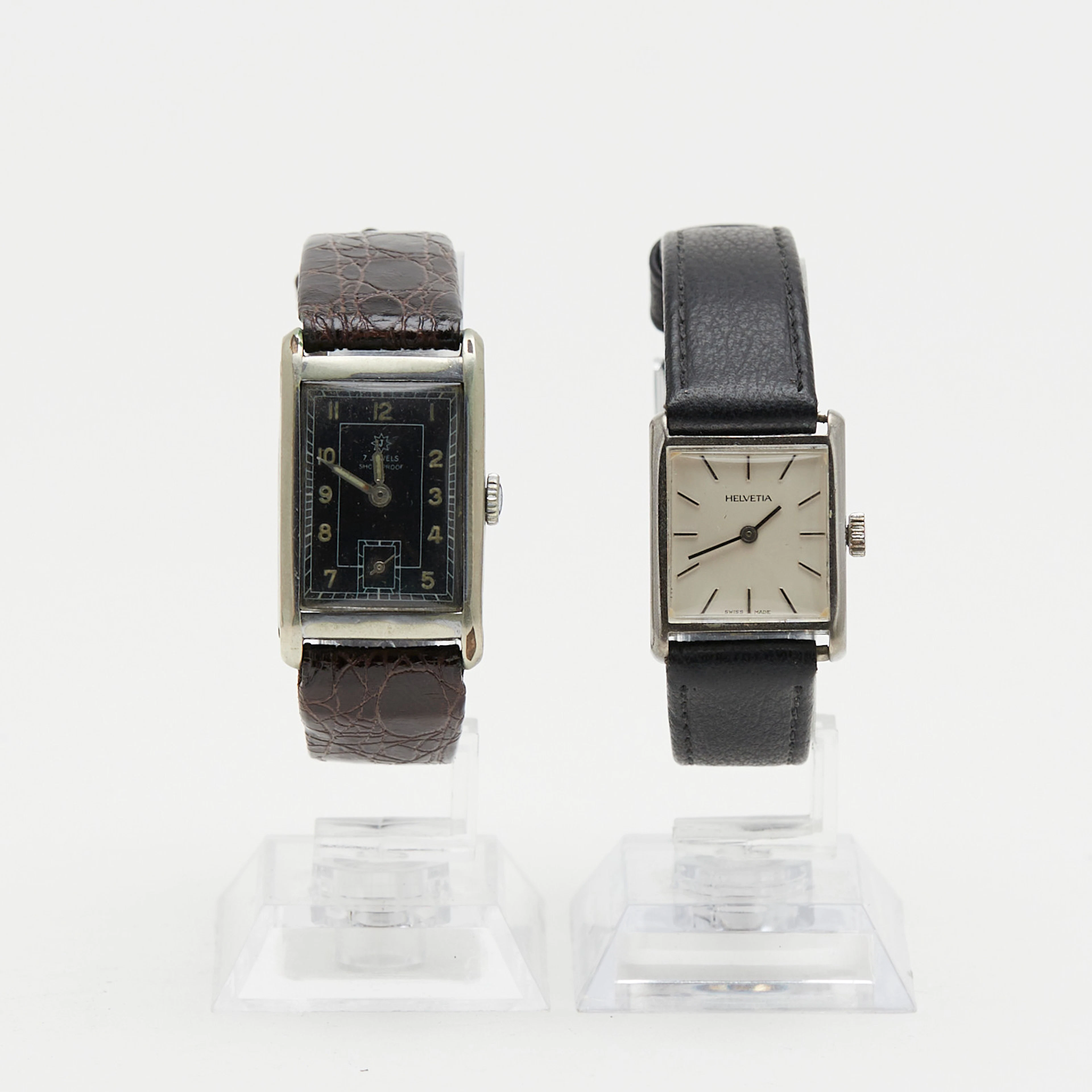HELVETIA & JUNGHANS. Paar Armbanduhren, 20. Jahrhundert. (2).