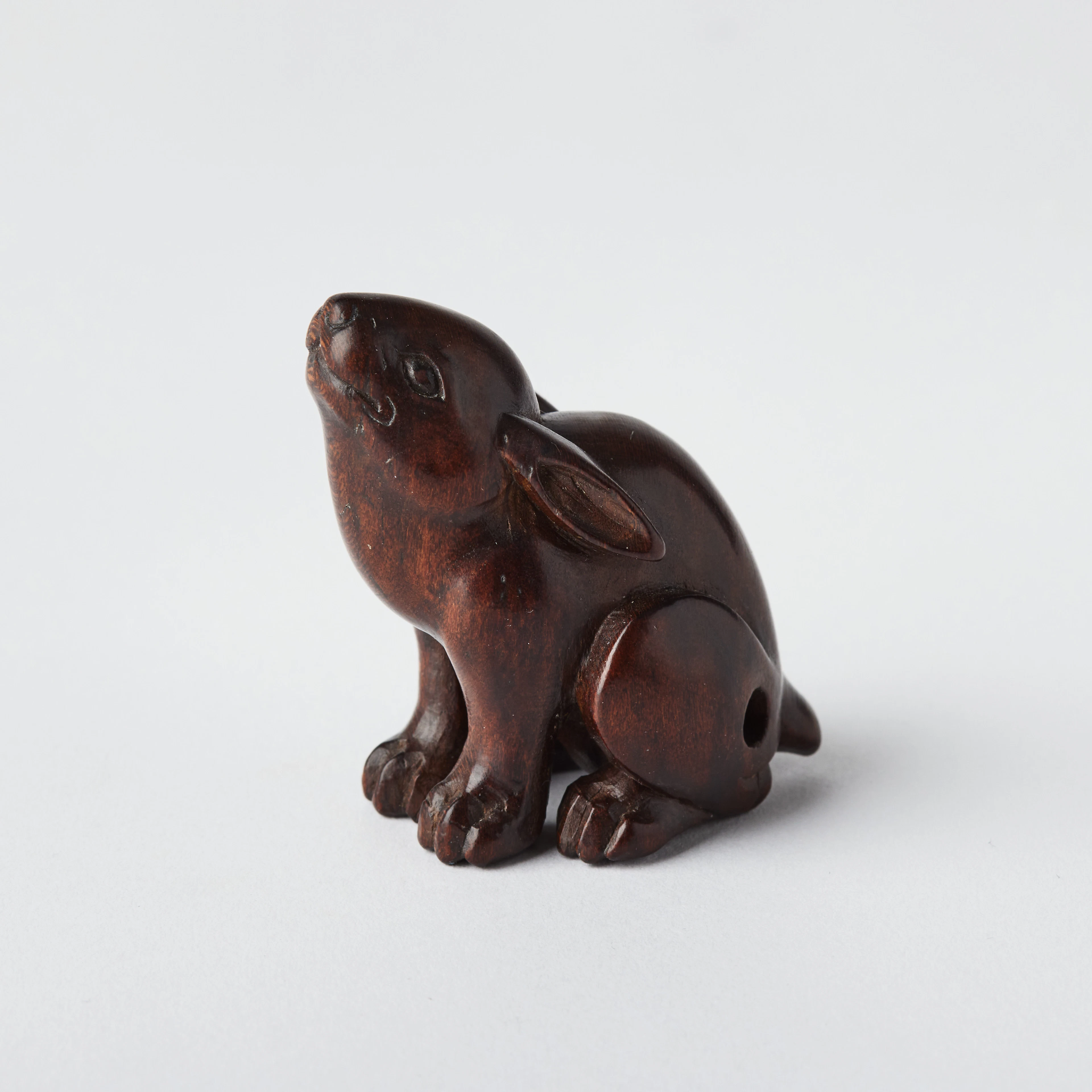 A Japanese Wood Netsuke of a Rabbit.