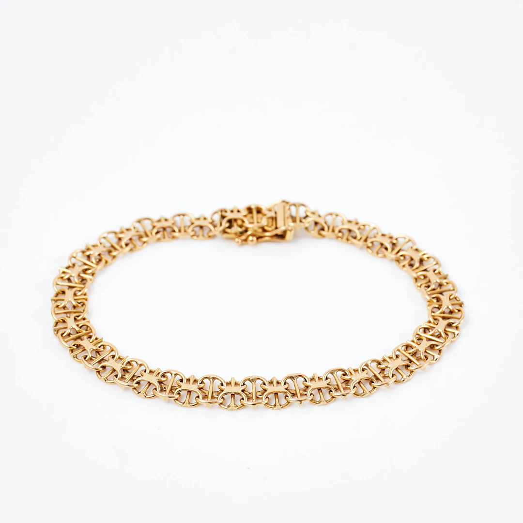 ARMBAND, 18 k guld, x-länk med stav, Clareus Guldsmeds Ab, Stockholm, 1990.