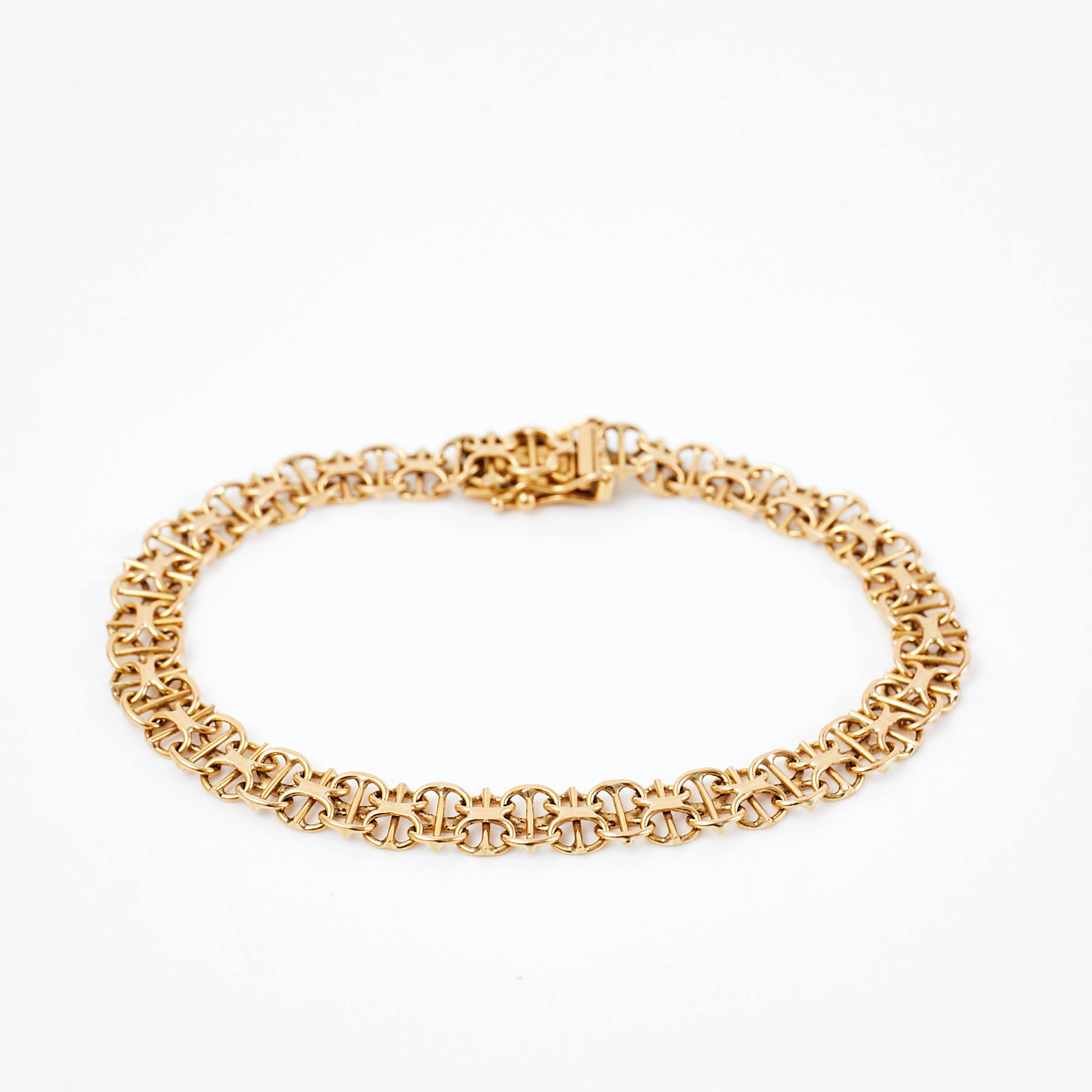 ARMBAND, 18 k guld, x-länk med stav, Clareus Guldsmeds Ab, Stockholm, 1990.