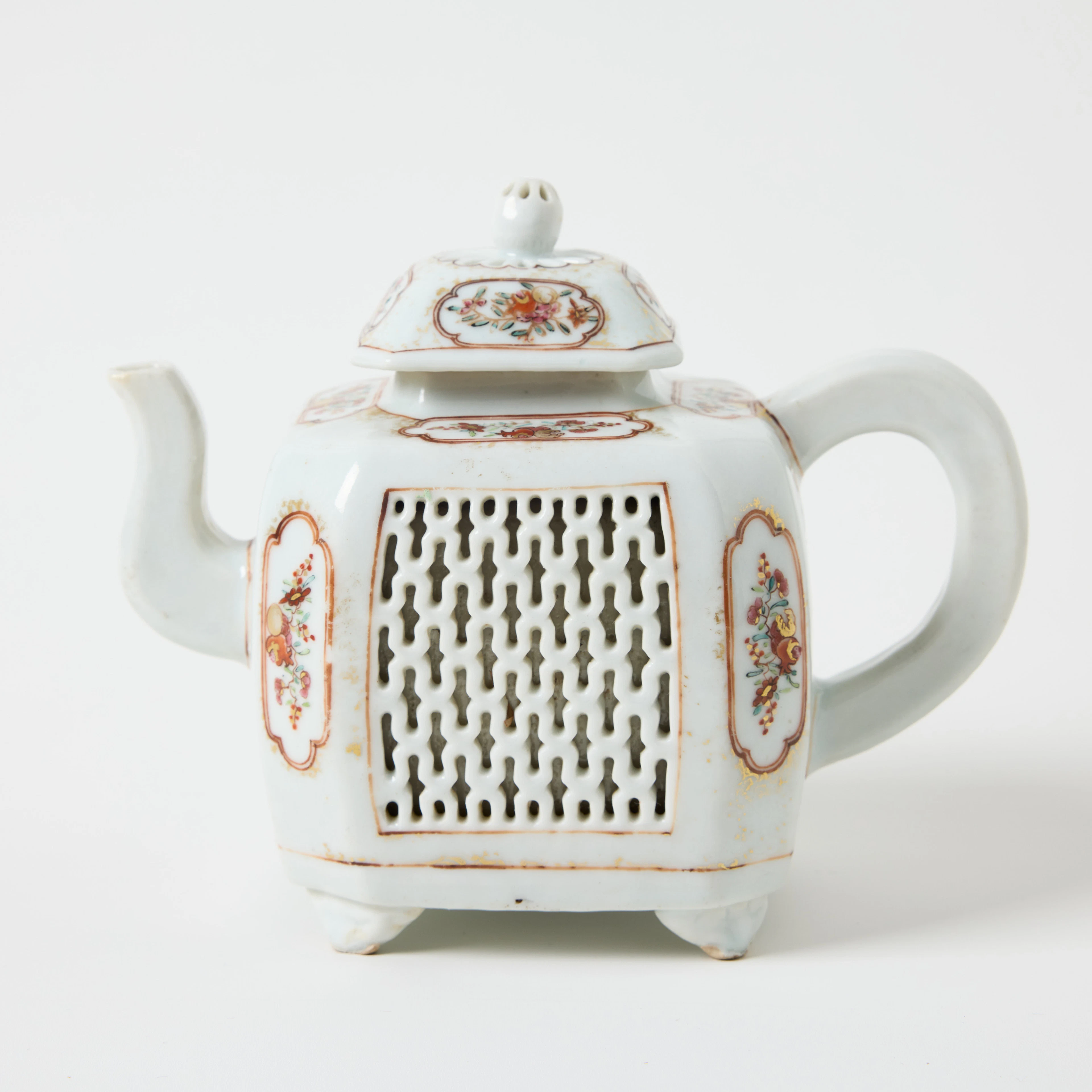 A Chinese Famille Rose Reticulated Teapot and Cover.