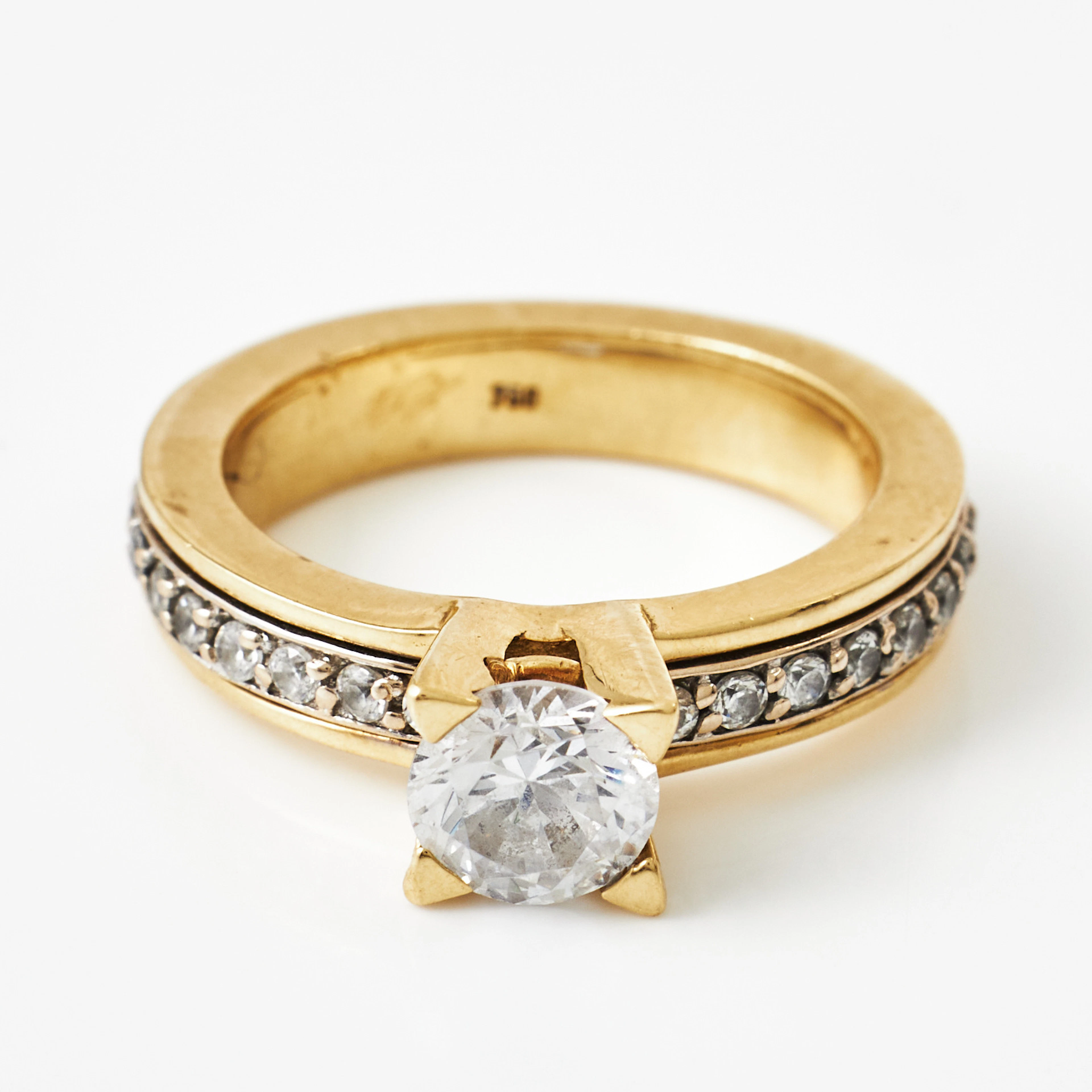 RING, 18 k guld, centersten cubic zirkon, rörlig mittdel i skenan
