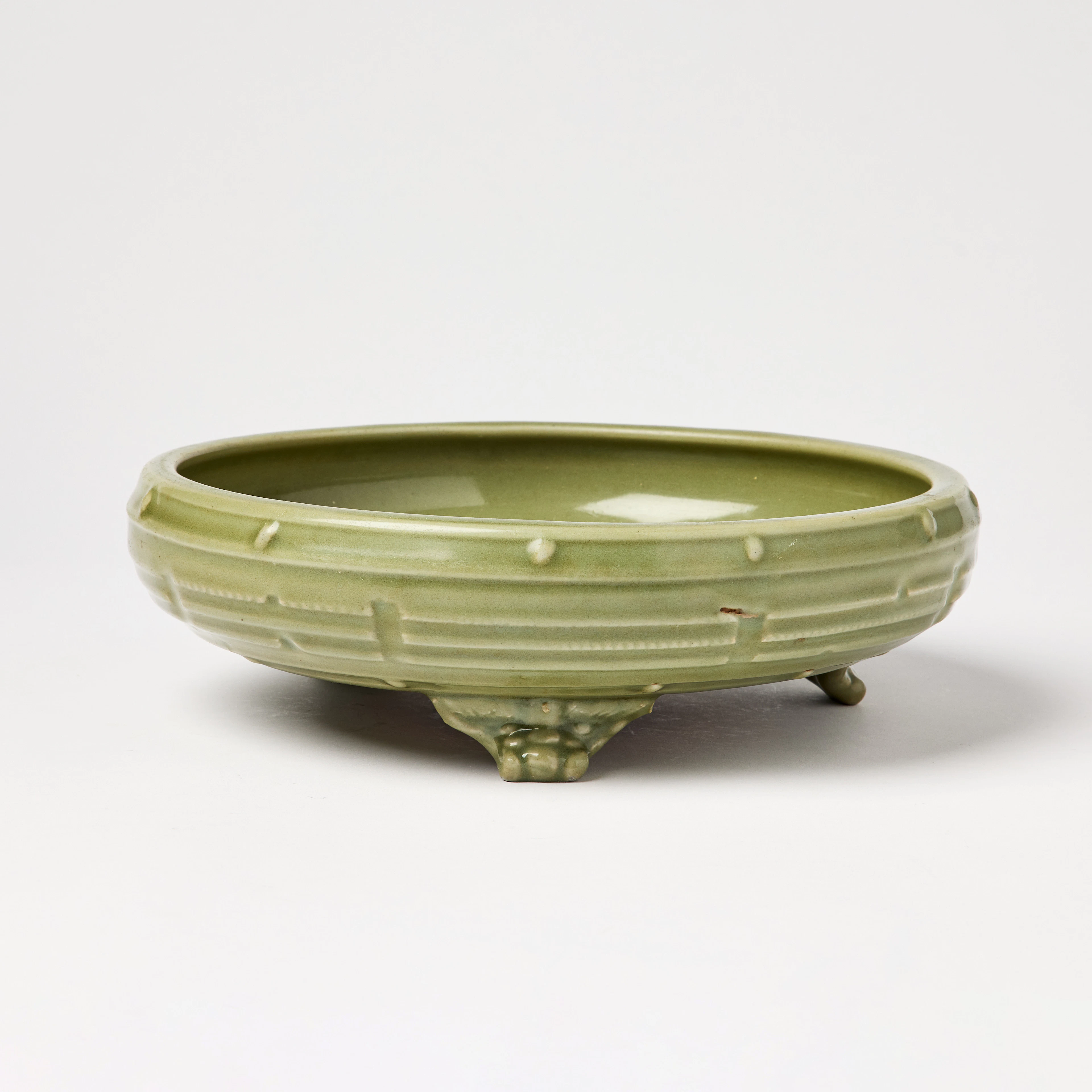 A Chinese 'Longquan' Celadon-Glazed 'Eight Trigrams' Tripod Censer.