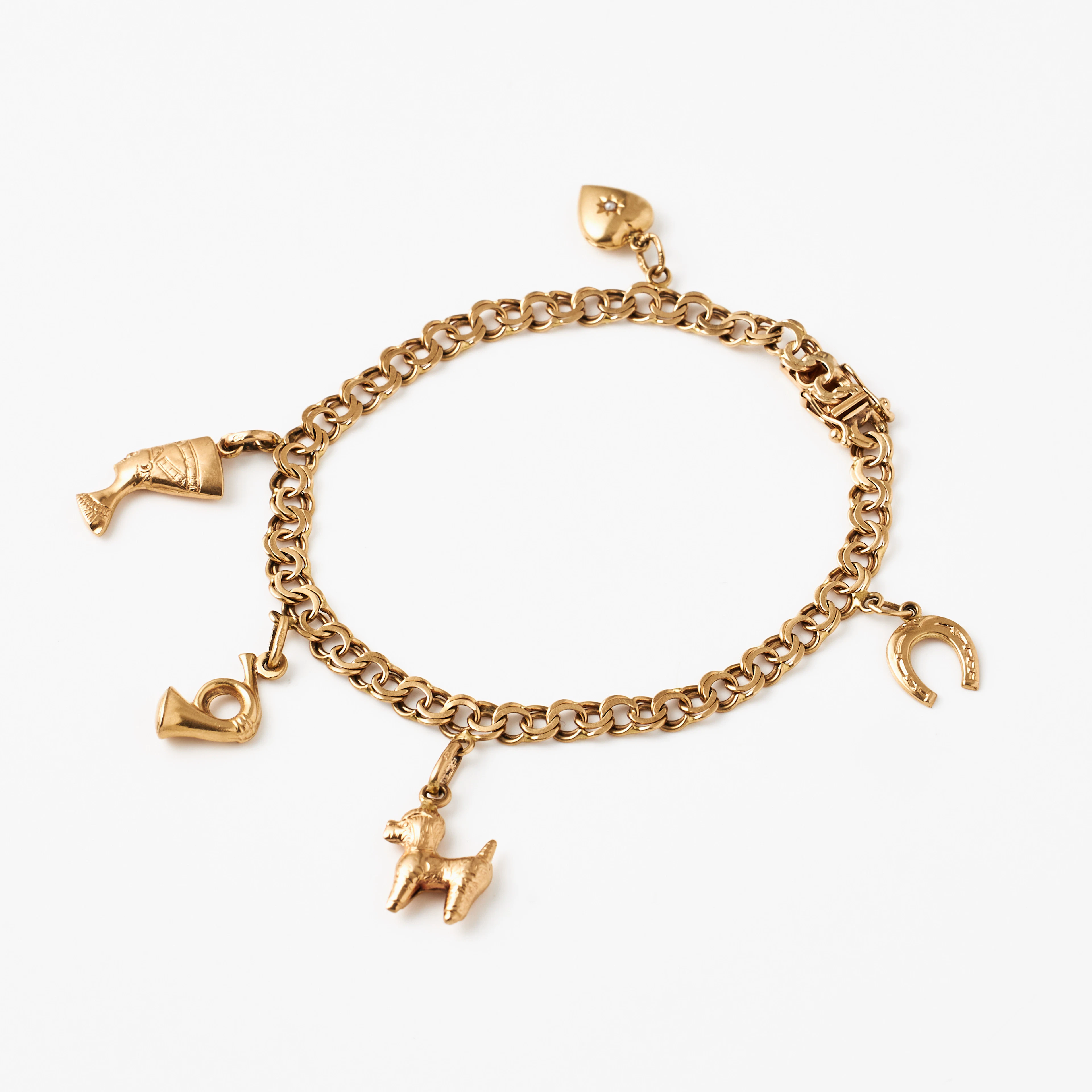 ARMBAND, 18 k guld, Bismarck, med berlocker bl a föreställande Nefertiti