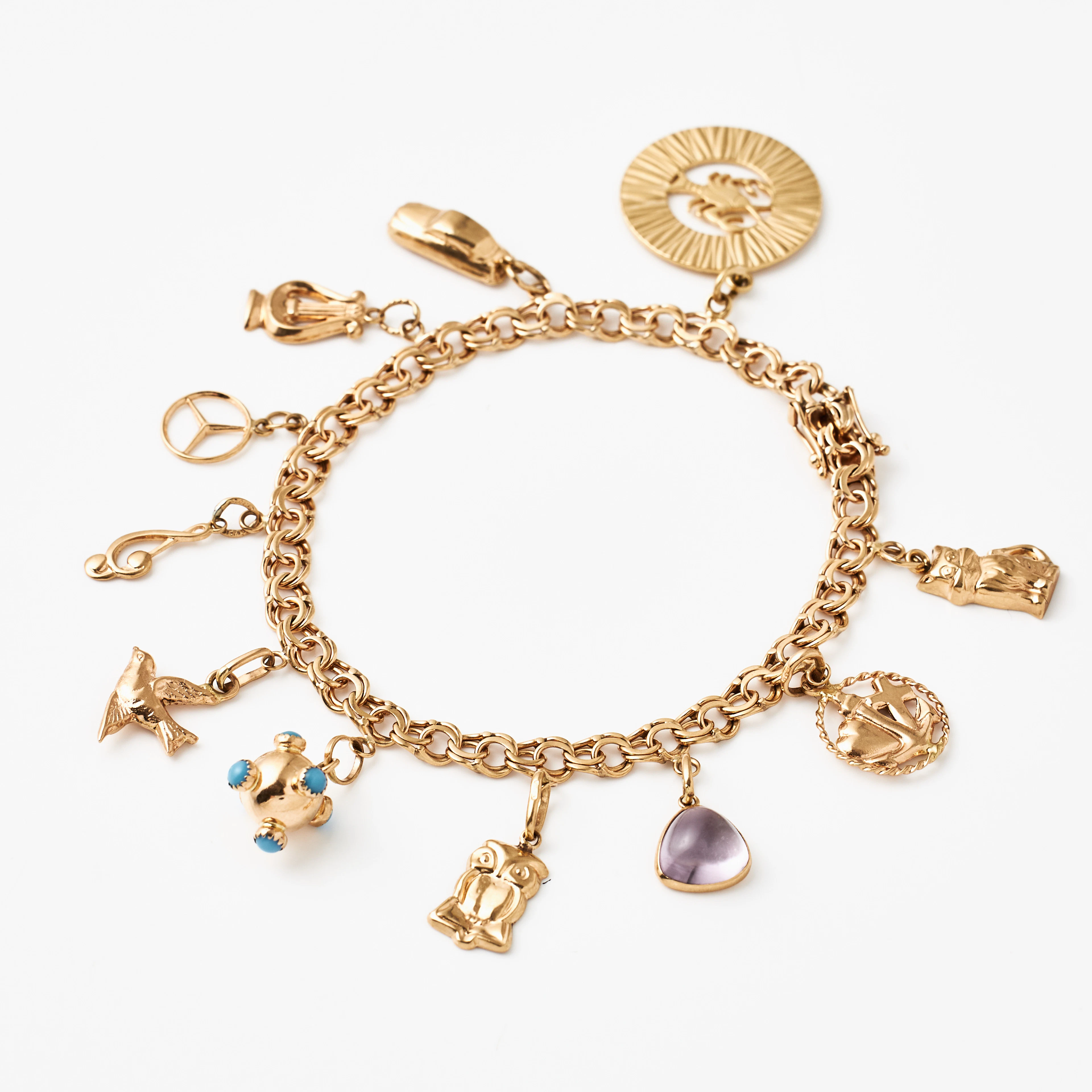 ARMBAND, 18 k guld, Bismarck, med 11 berlocker bl a föreställande