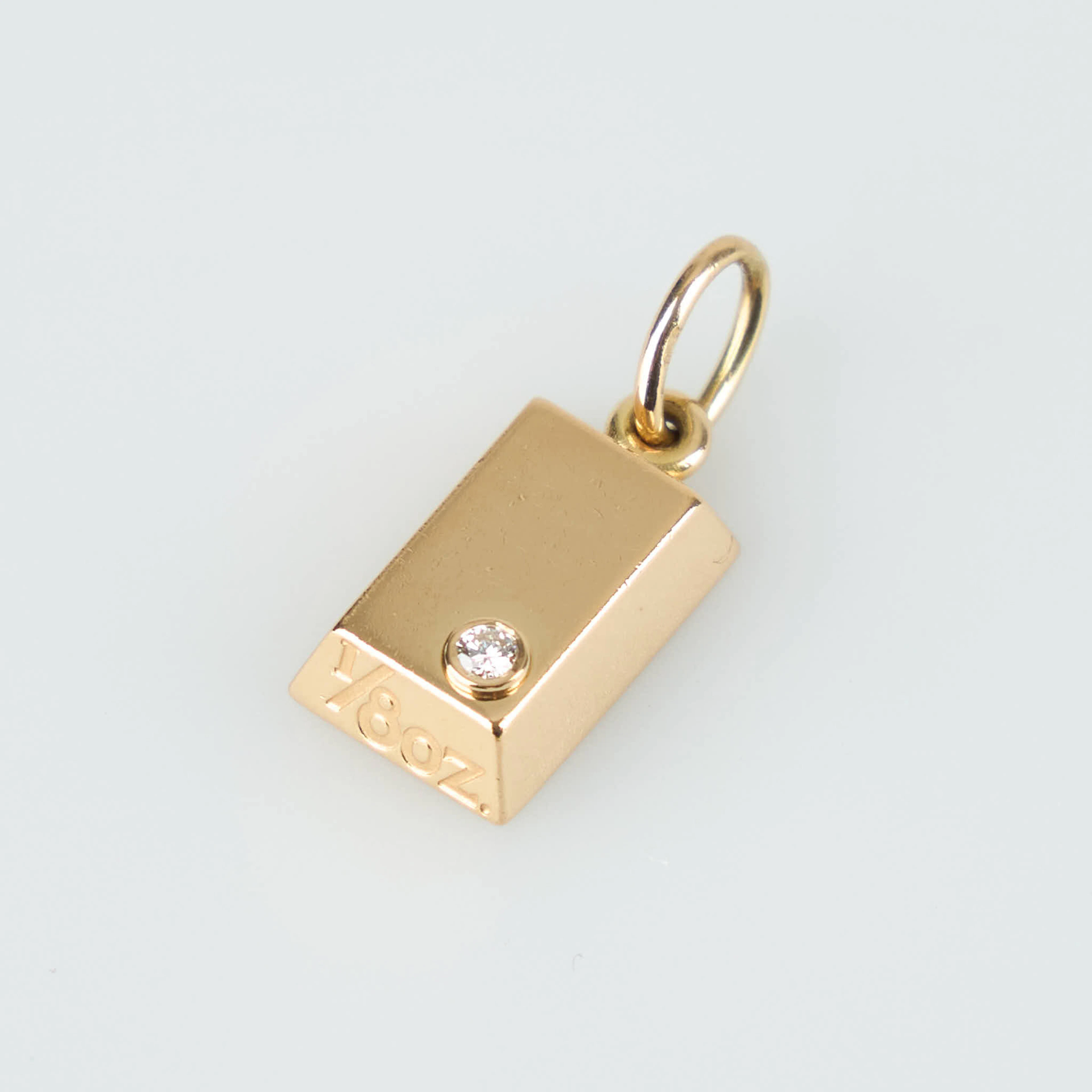 CARTIER, Hänge, guldtacka 1/8 uns med diamant, 18K guld, 1992.