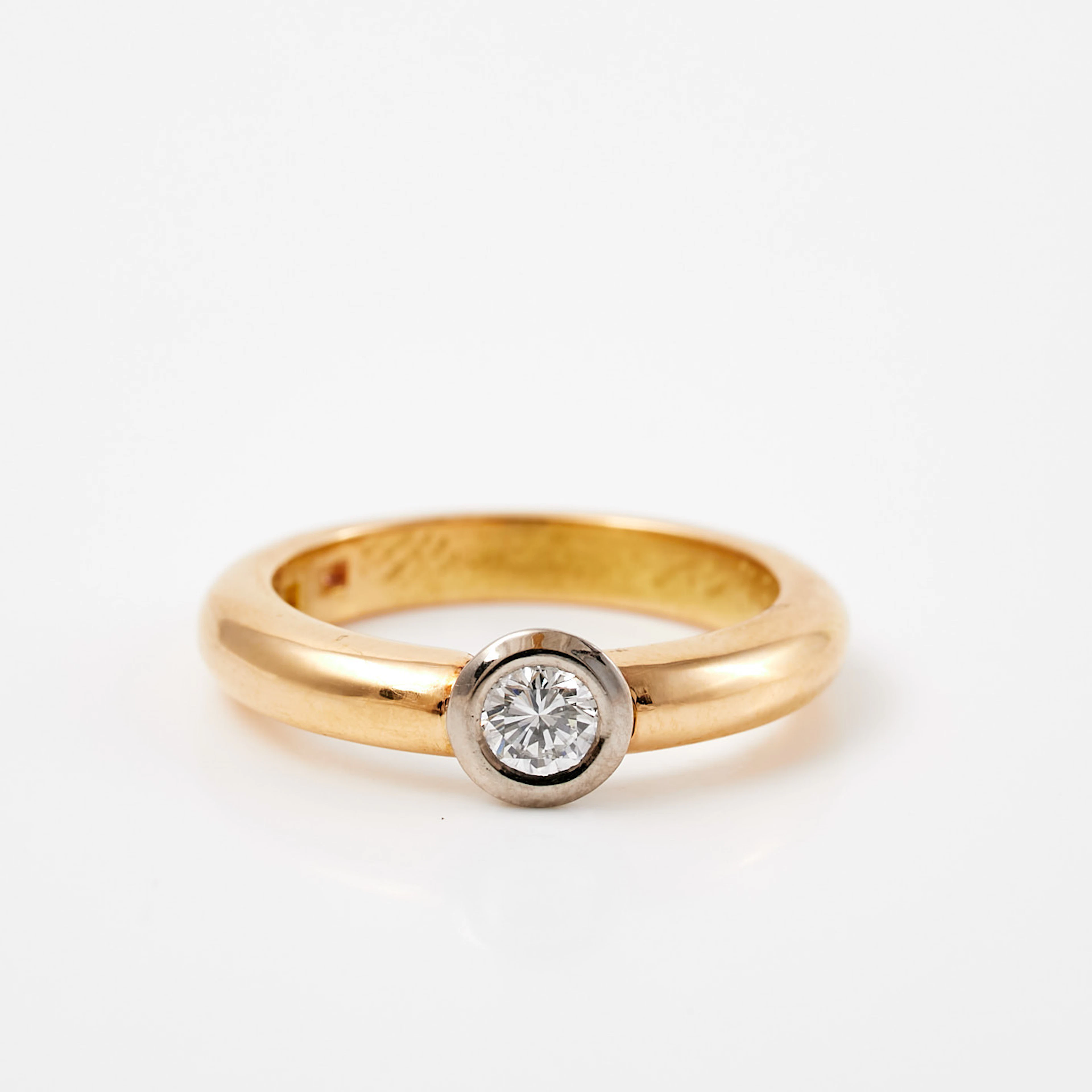 RING, 18 k röd- samt vitguld, 1 briljantslipad diamant, ca 0,25 ct