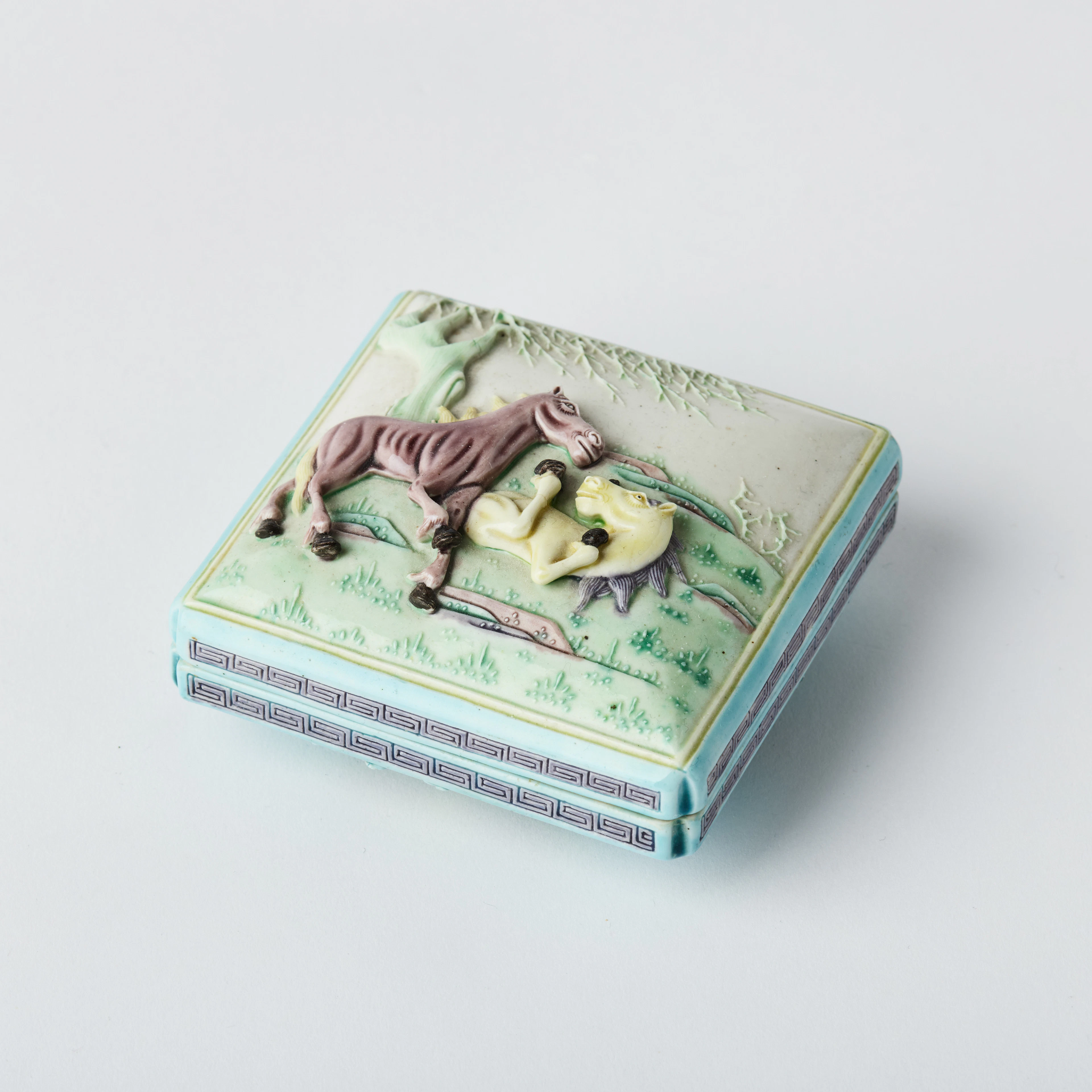 A Chinese Biscuit Porcelain 'Horses' Box and Cover.