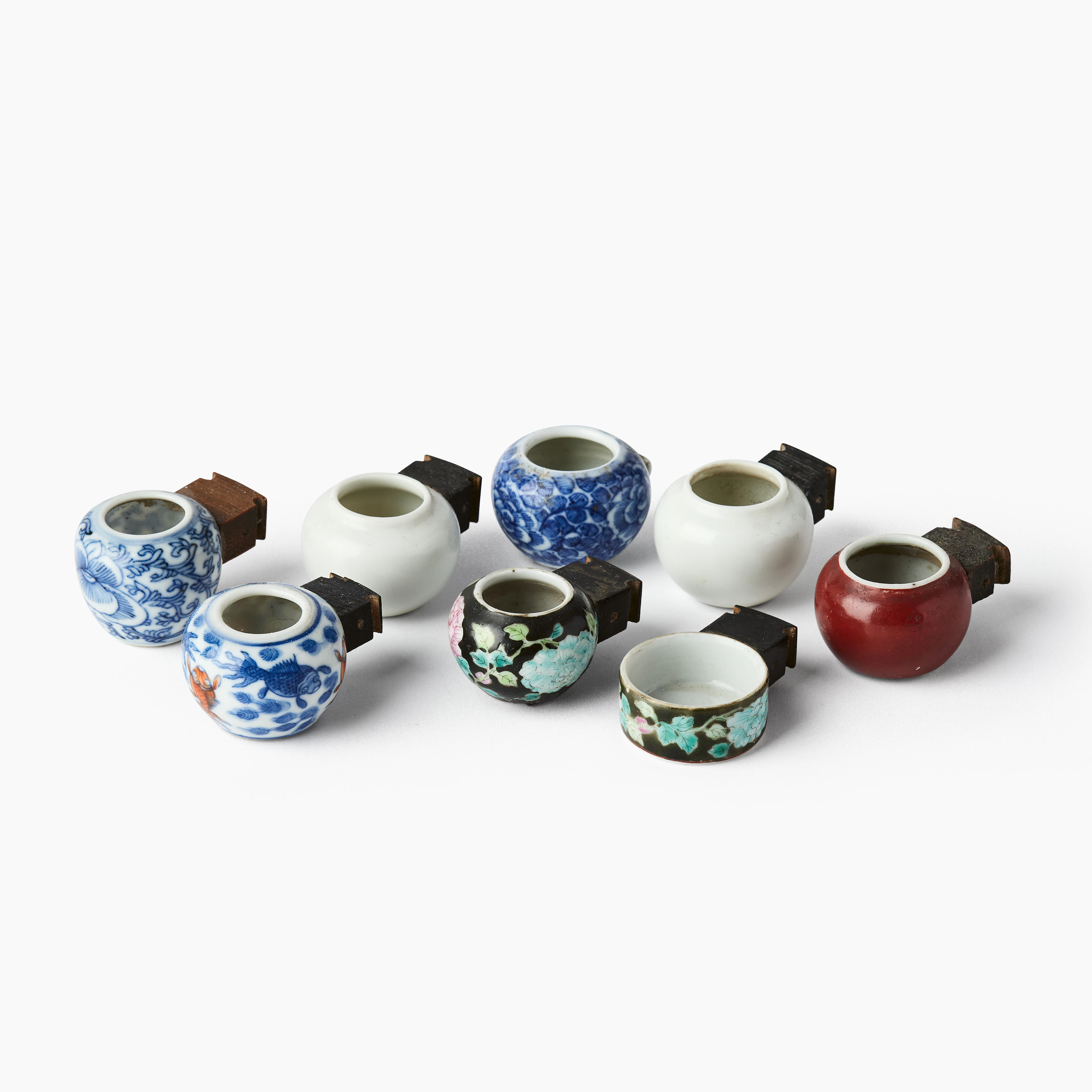 A Group of Eight Chinese Porcelain Bird Feeders.