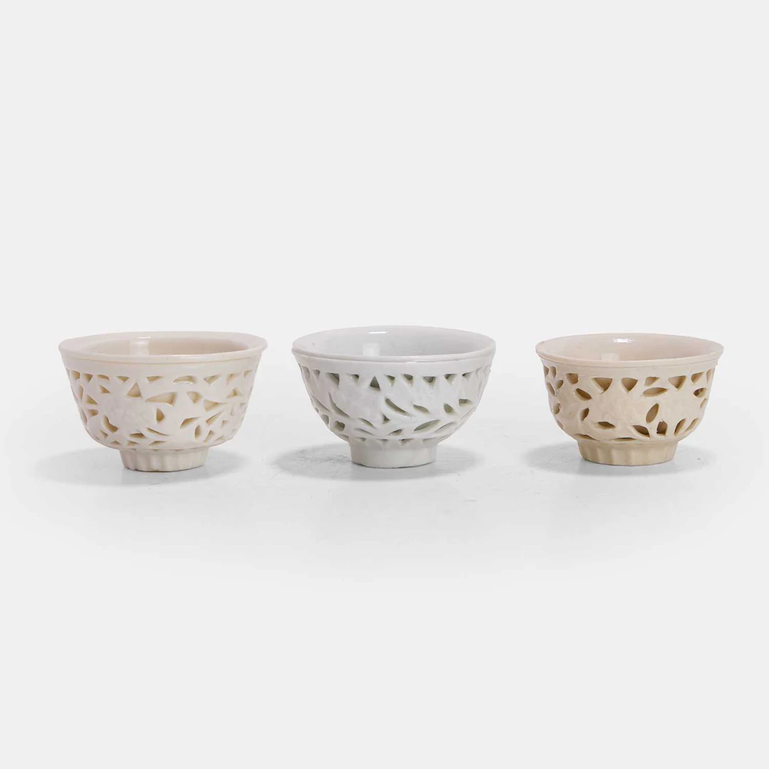 Three Chinese blanc de Chine 'linglong' reticulated cups 17th century