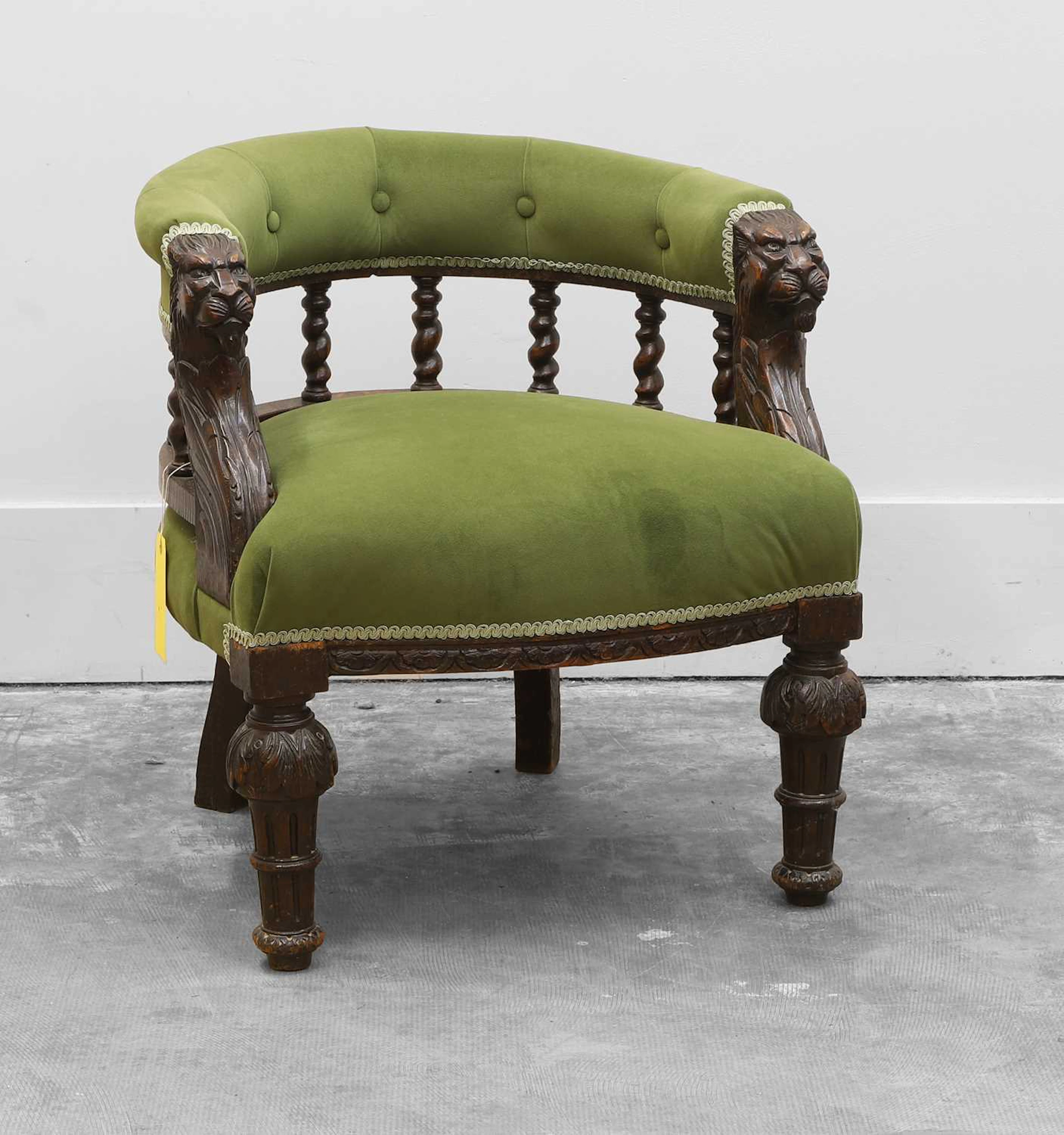 A Jacobean style carved oak captain's chair
