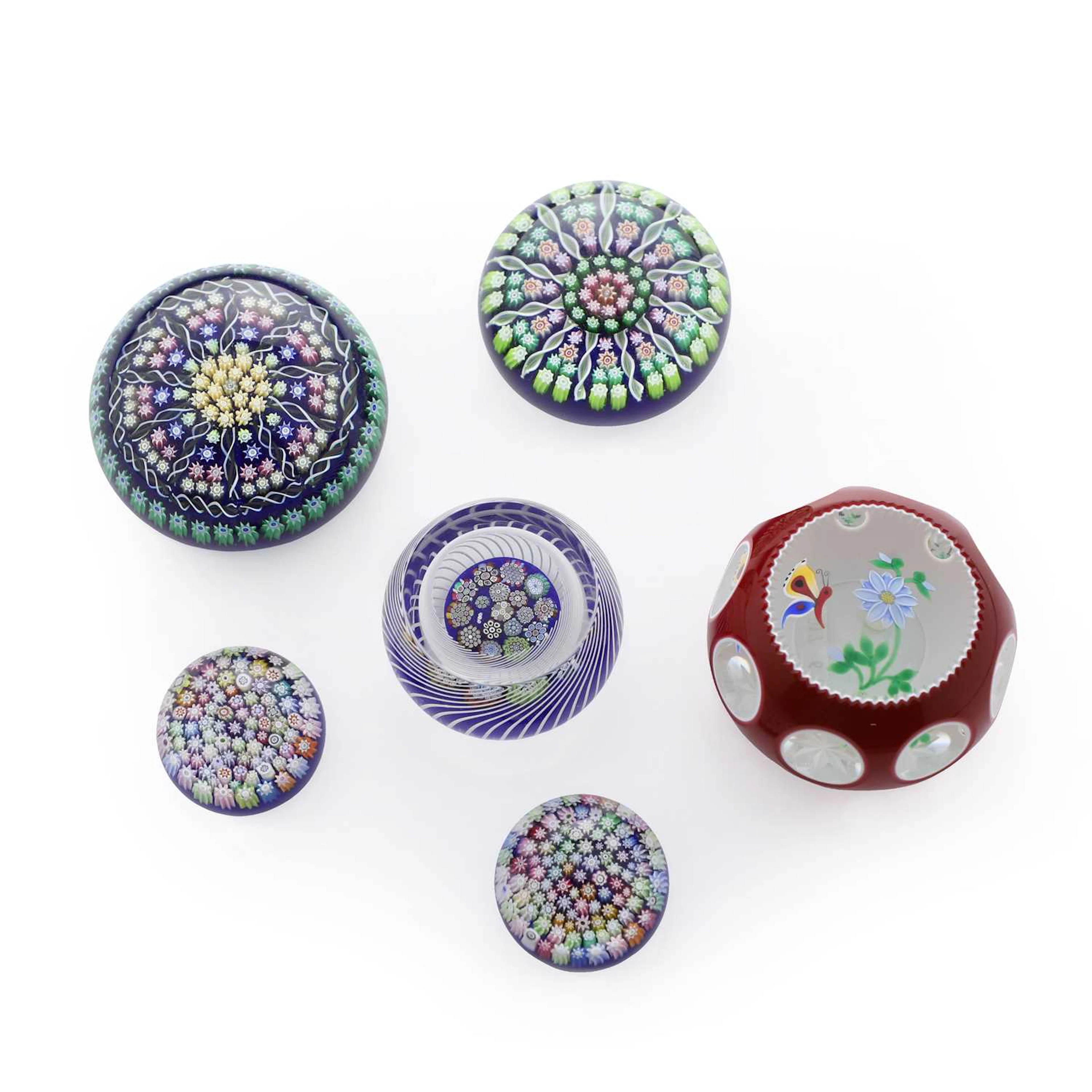 A collection of six Scottish glass paperweights circa 1990-2000