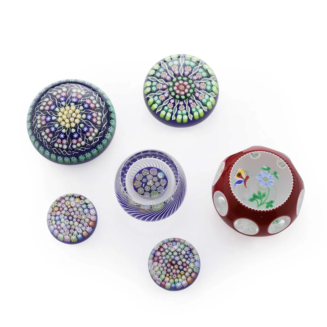 A collection of six Scottish glass paperweights circa 1990-2000