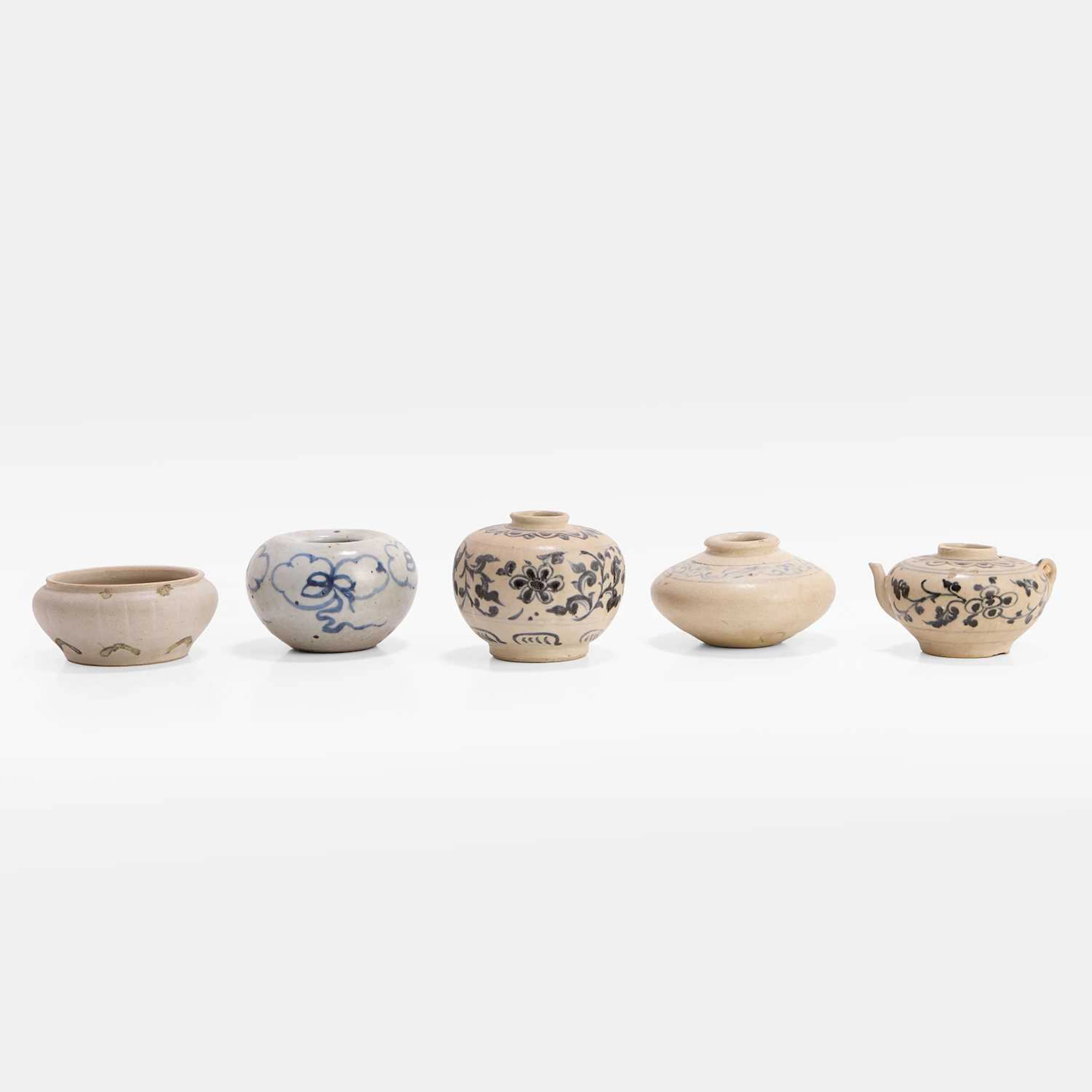 A collection of four Southeast Asian blue and white water pots 15th-17th