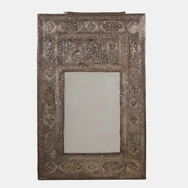 A Qajar white metal wall mirror late 19th century/early 20th century, Iran