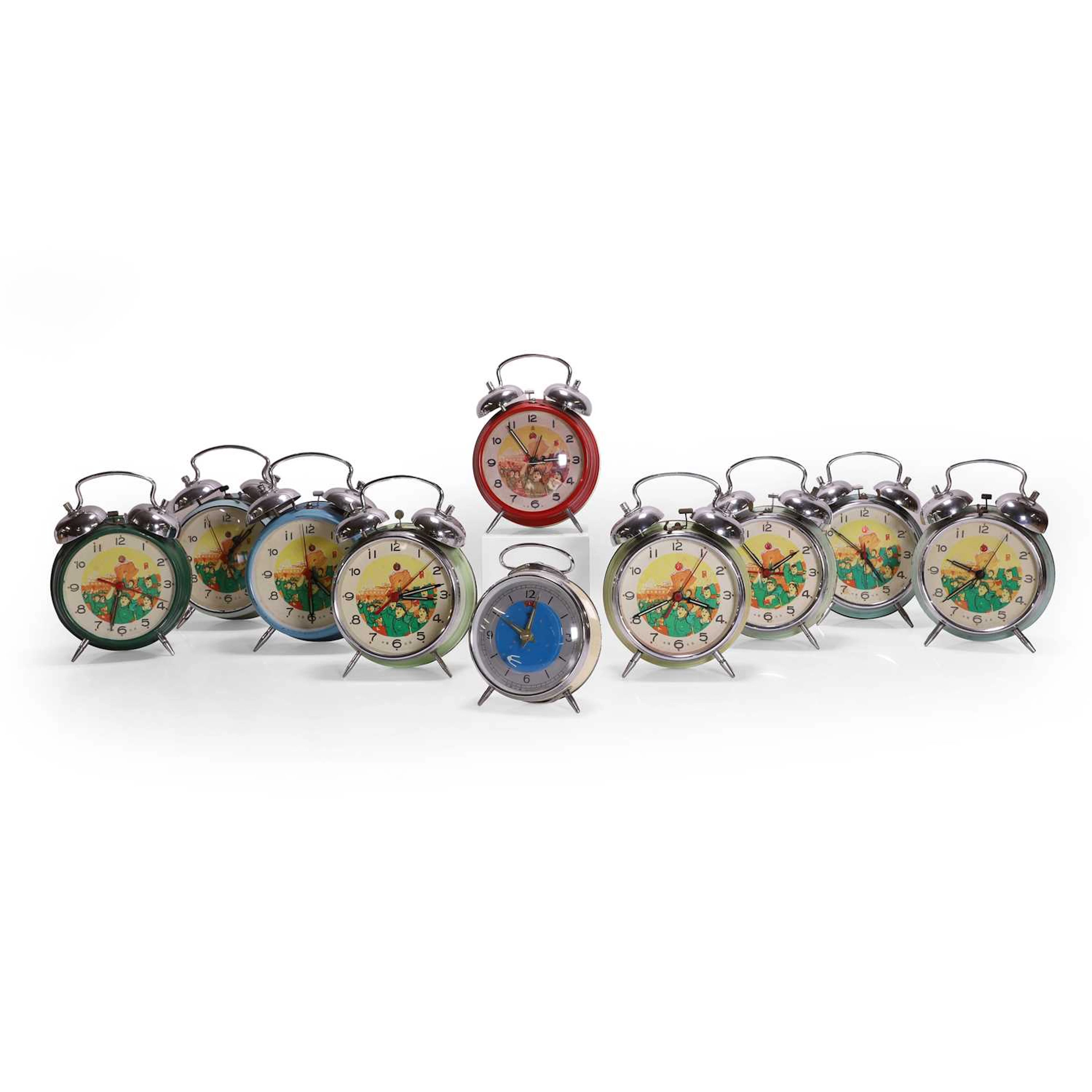 A group of ten Chinese Cultural Revolution alarm clocks circa 1970