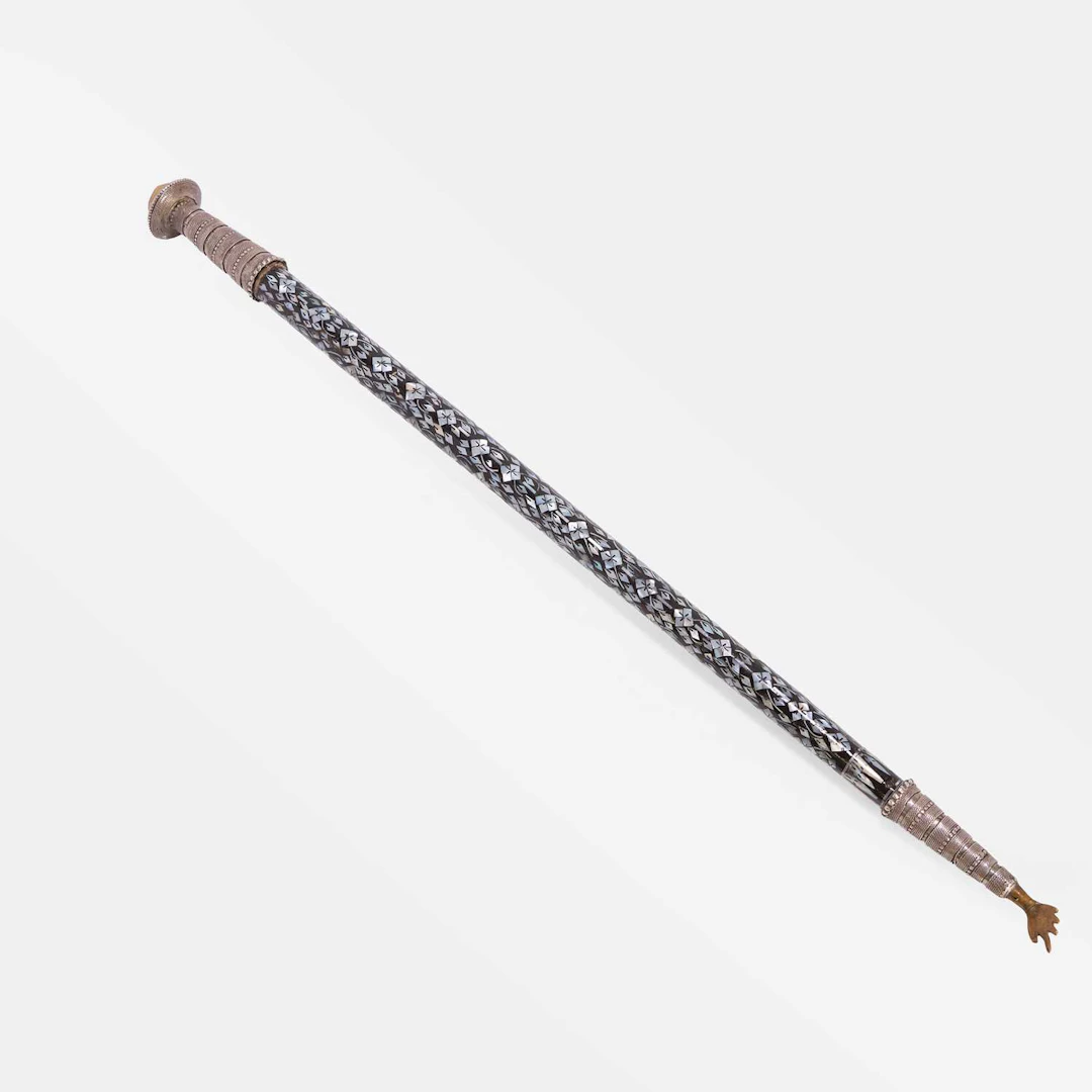 A brass-mounted and mother-of-pearl inlaid cane early 20th century