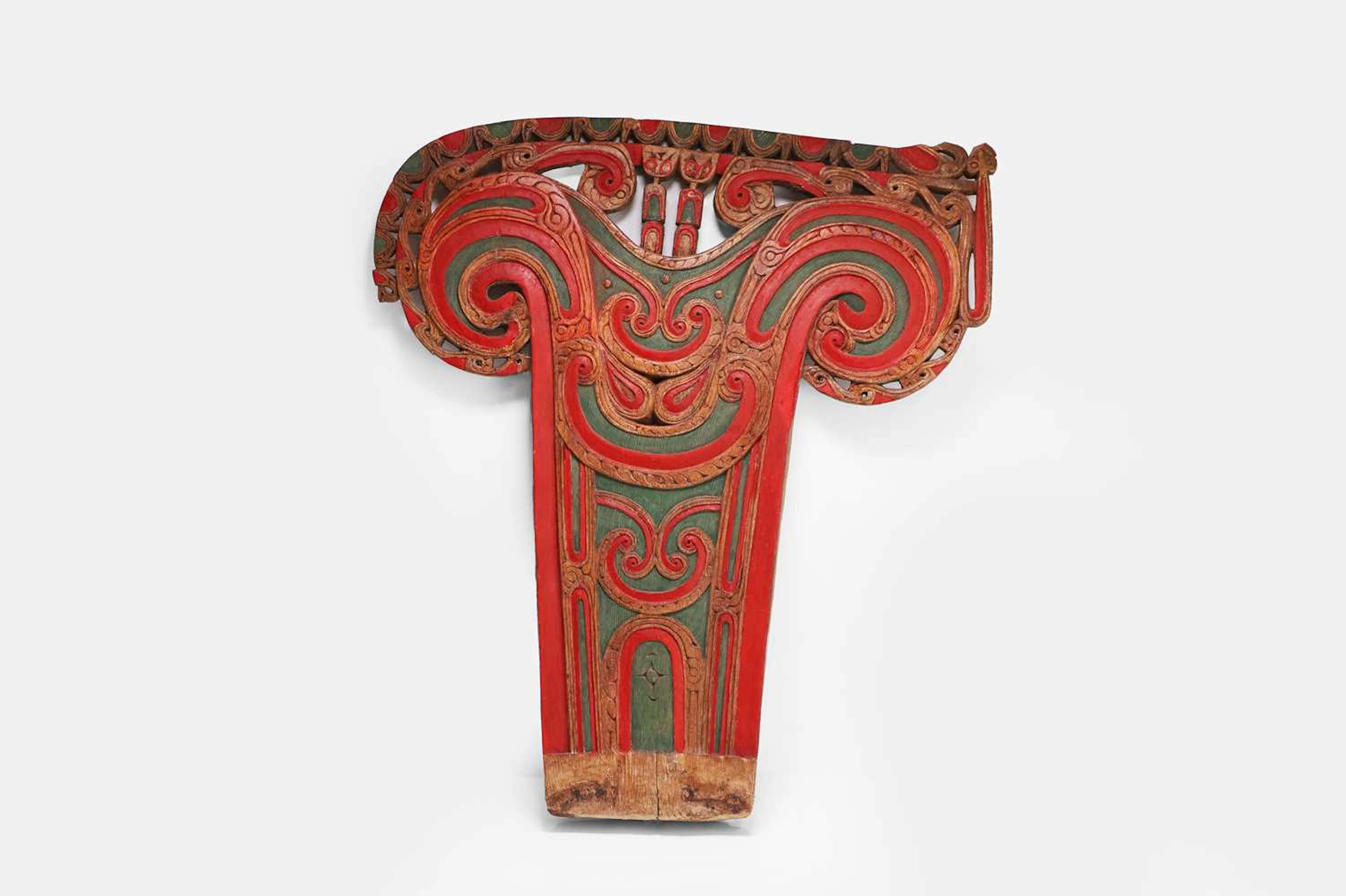 A carved and polychrome painted wooden Iagim or splashboard 20th century