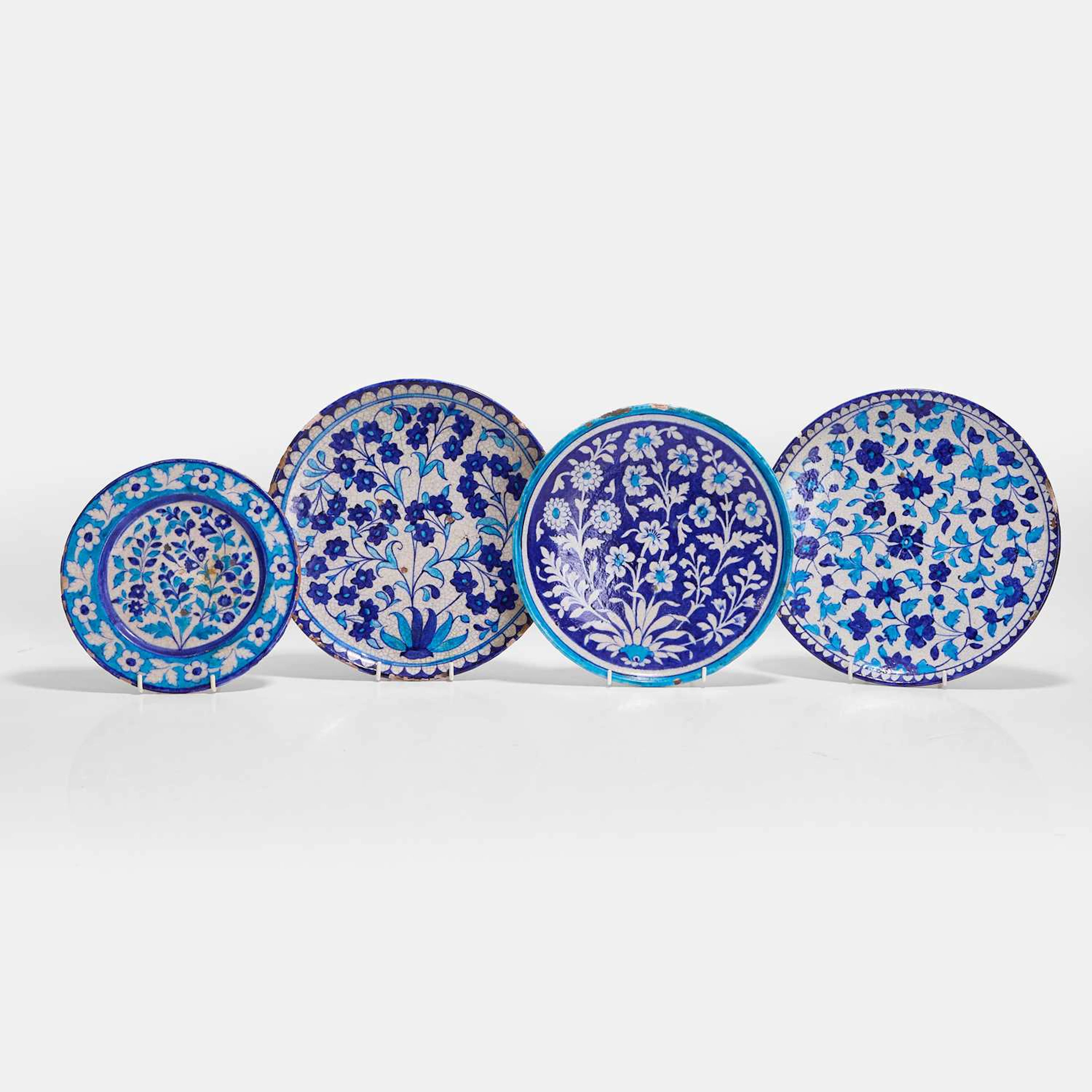 A collection of four Multan cobalt-blue and turquoise-glazed pottery