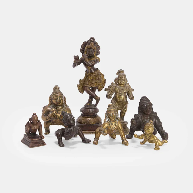 A collection of Indian brass Bala Krishna figures first half of the