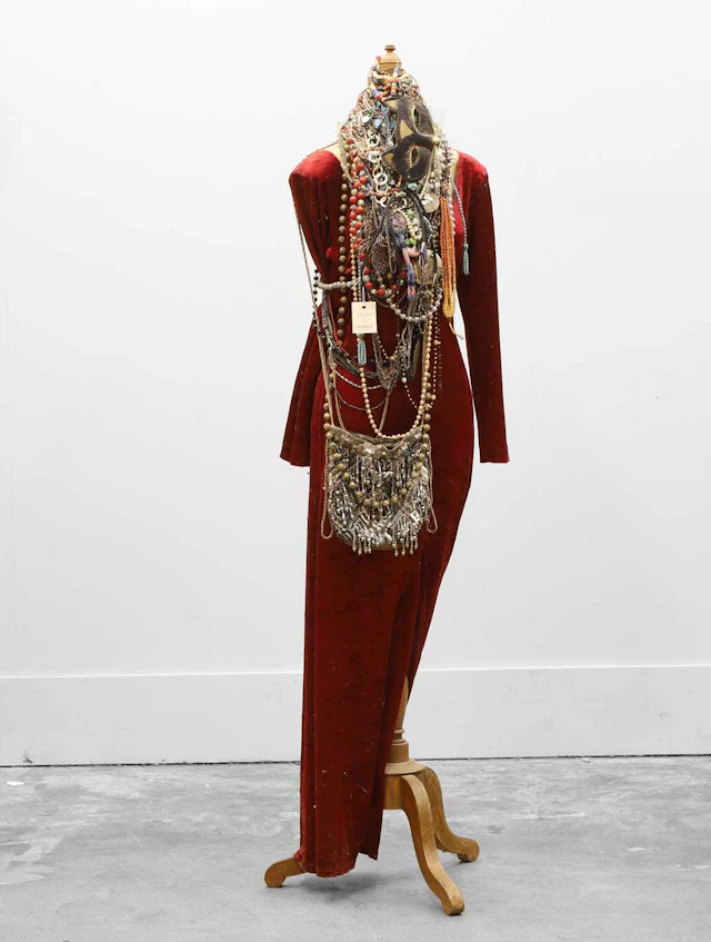 A vintage mannequin displaying a collection of costume jewellery 20th