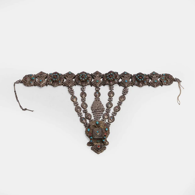 A gem-set and chased gilt white-metal pectoral ornament 19th century
