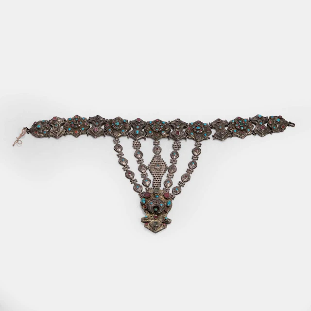 A gem-set and chased gilt white-metal pectoral ornament 19th century