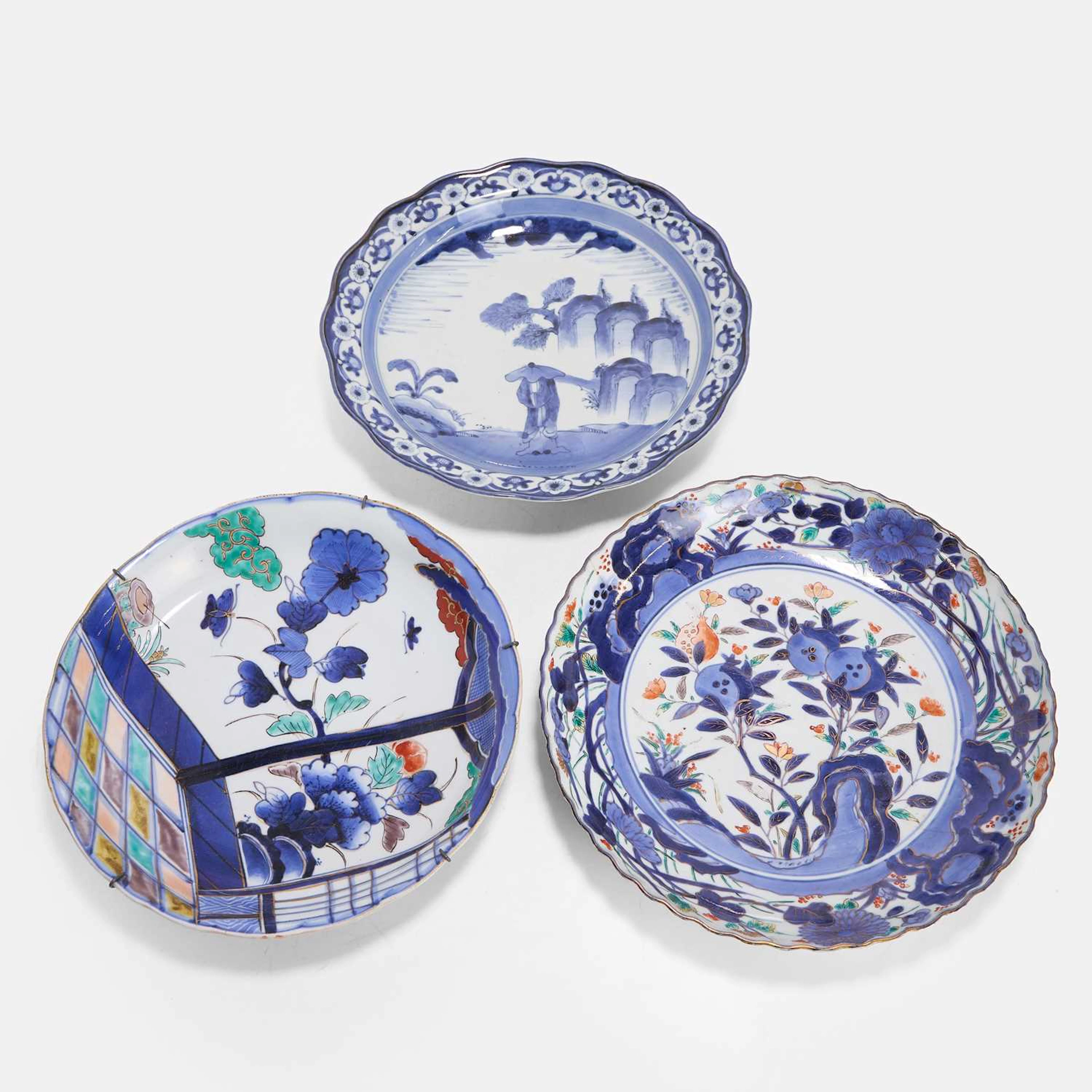 A collection of three Japanese blue and white plates 19th century