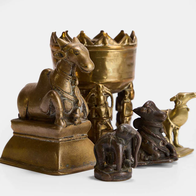 A group of Indian cast brass and bronze items 20th century, Southern India