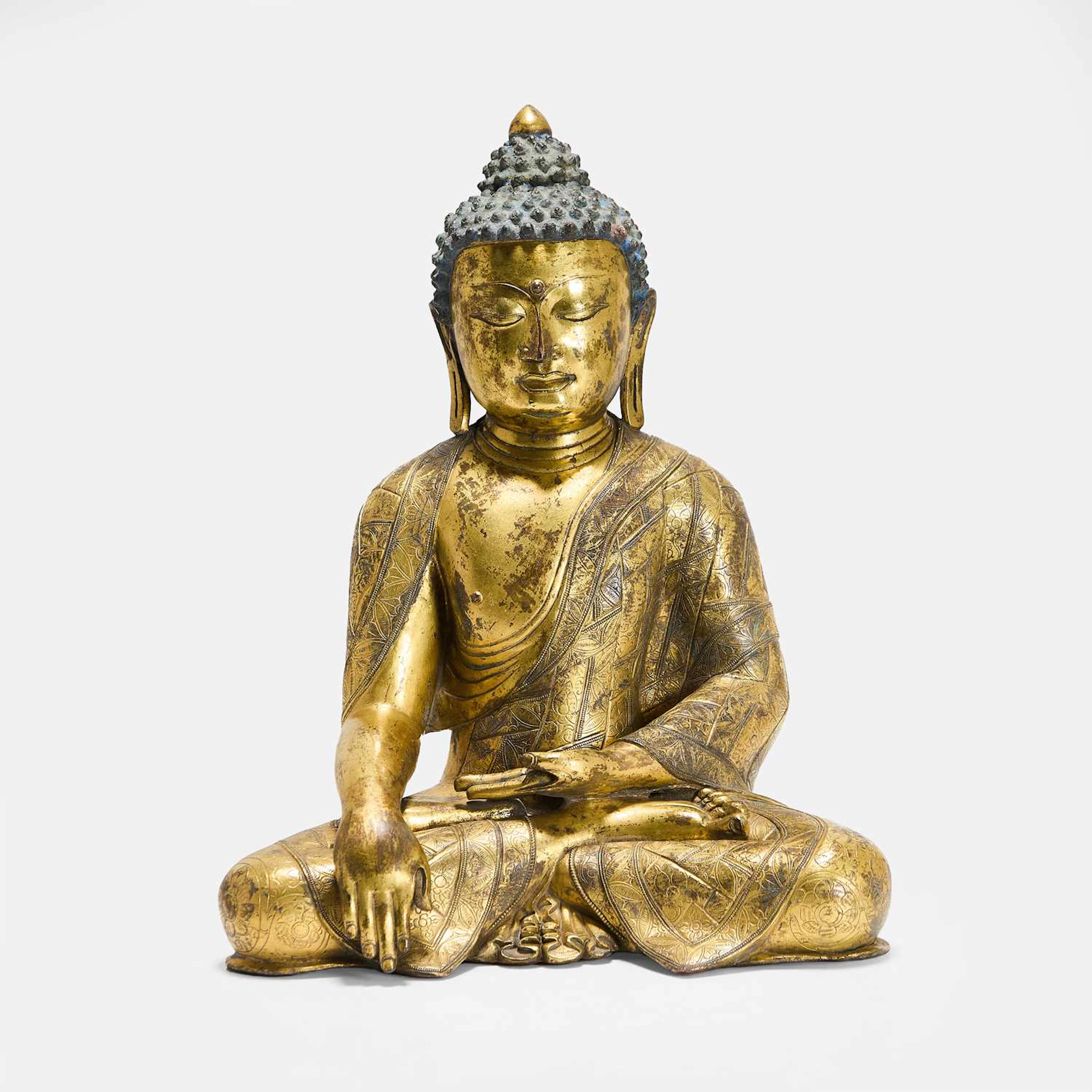A Chinese gilt-bronze Shakyamuni Buddha probably Ming dynasty