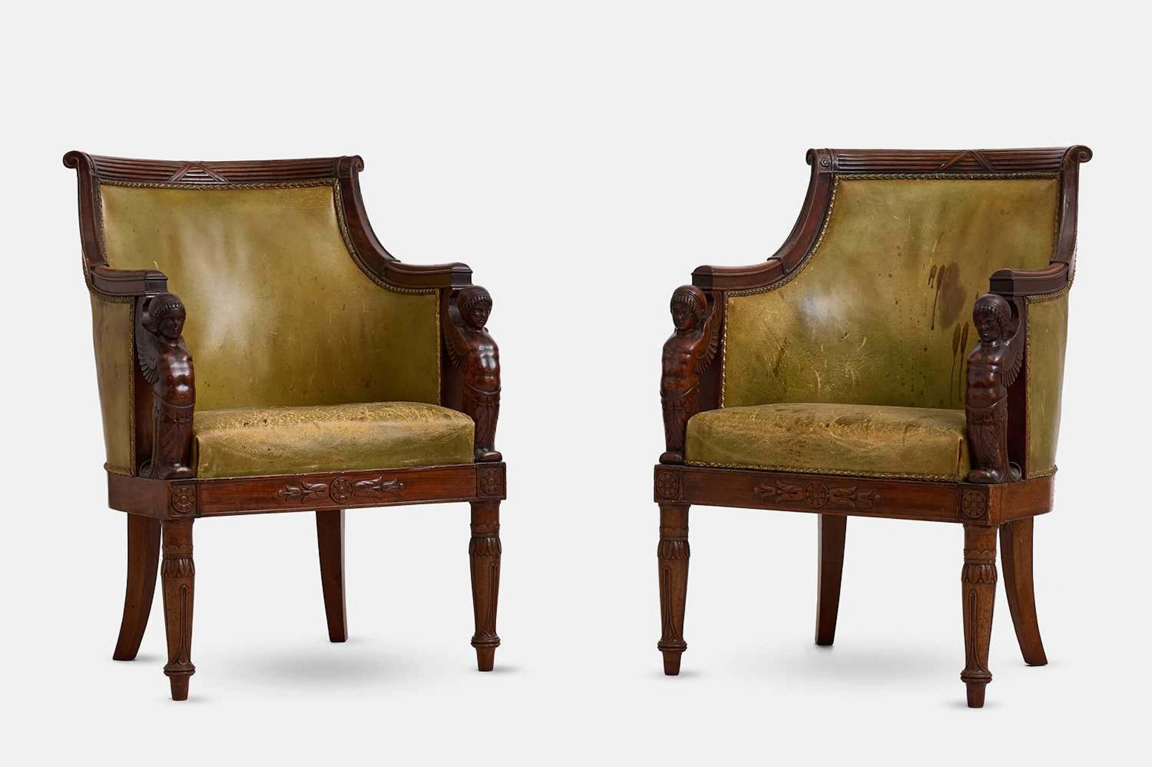 A pair of Empire mahogany bergère library armchairs circa 1810, French