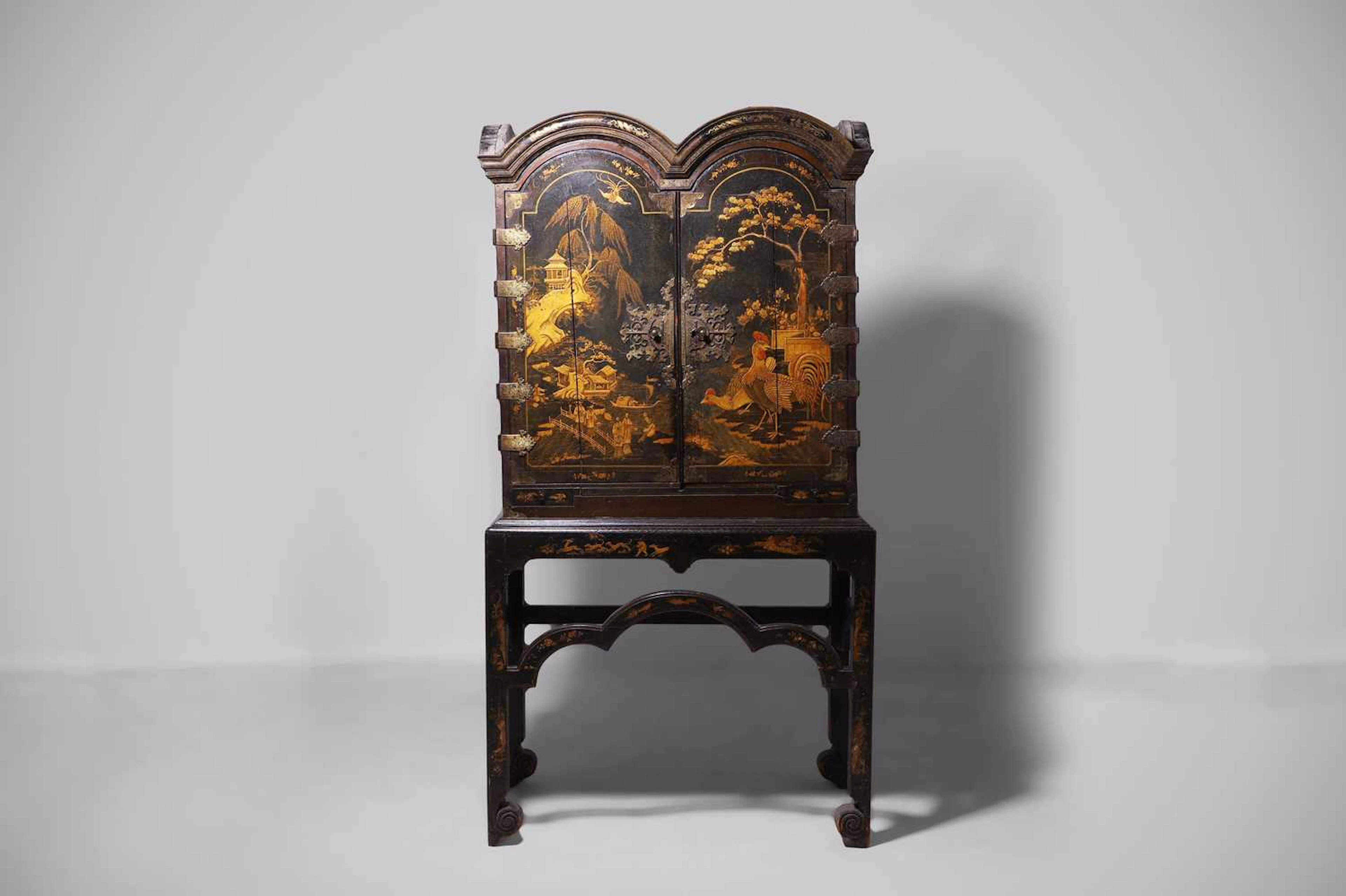 A Queen Anne black-and-gilt japanned cabinet-on-stand early 18th century