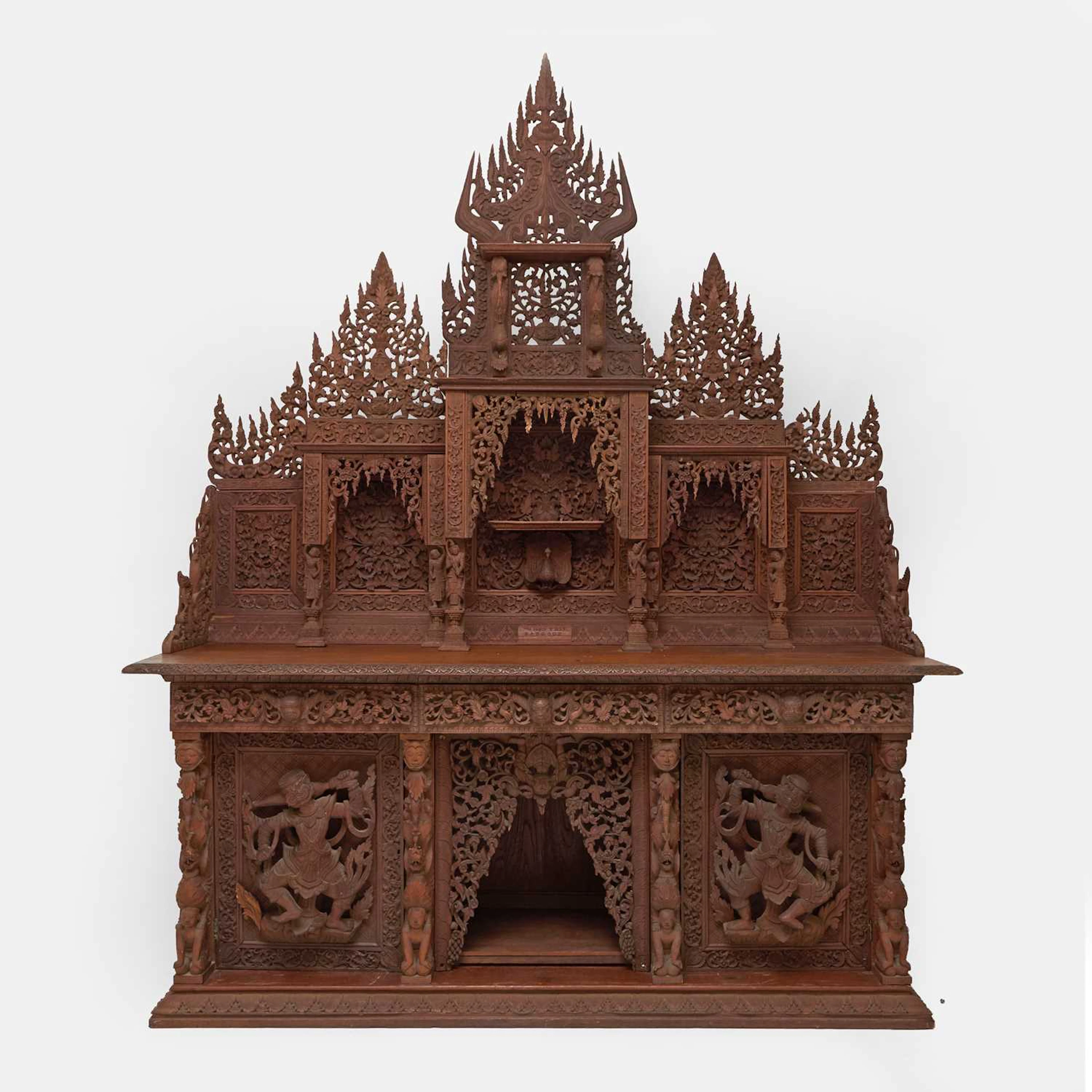 A large Burmese (Myanmar) carved teak shrine cabinet by Maung Hpo