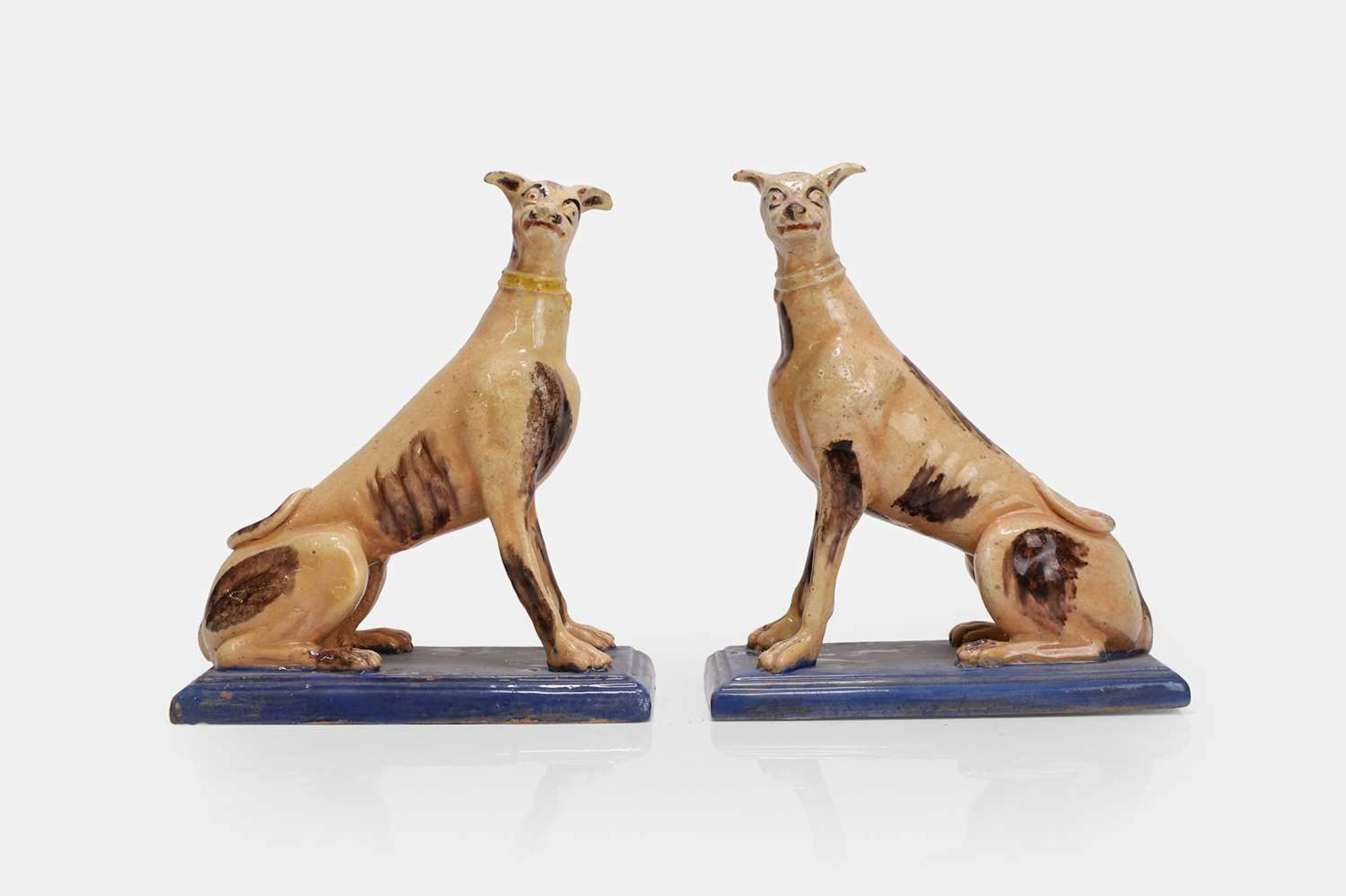 A pair of faience greyhound figures late 18th century, Continental