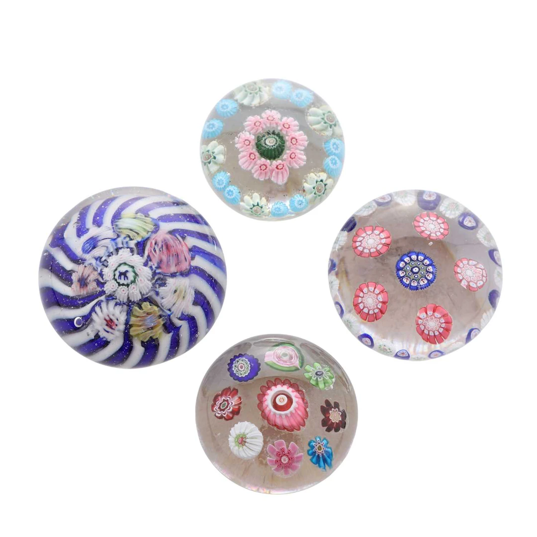 A group of four miniature glass paperweights circa 1850, French