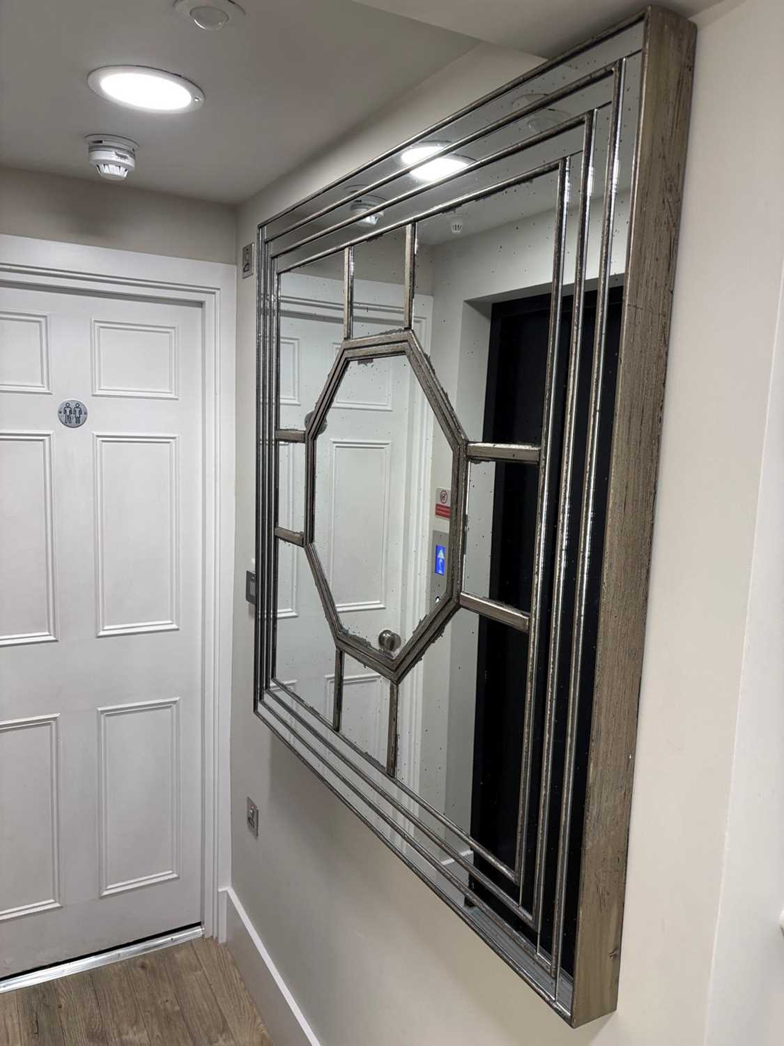 A large square silvered wall mirror by OKA of recent manufacture