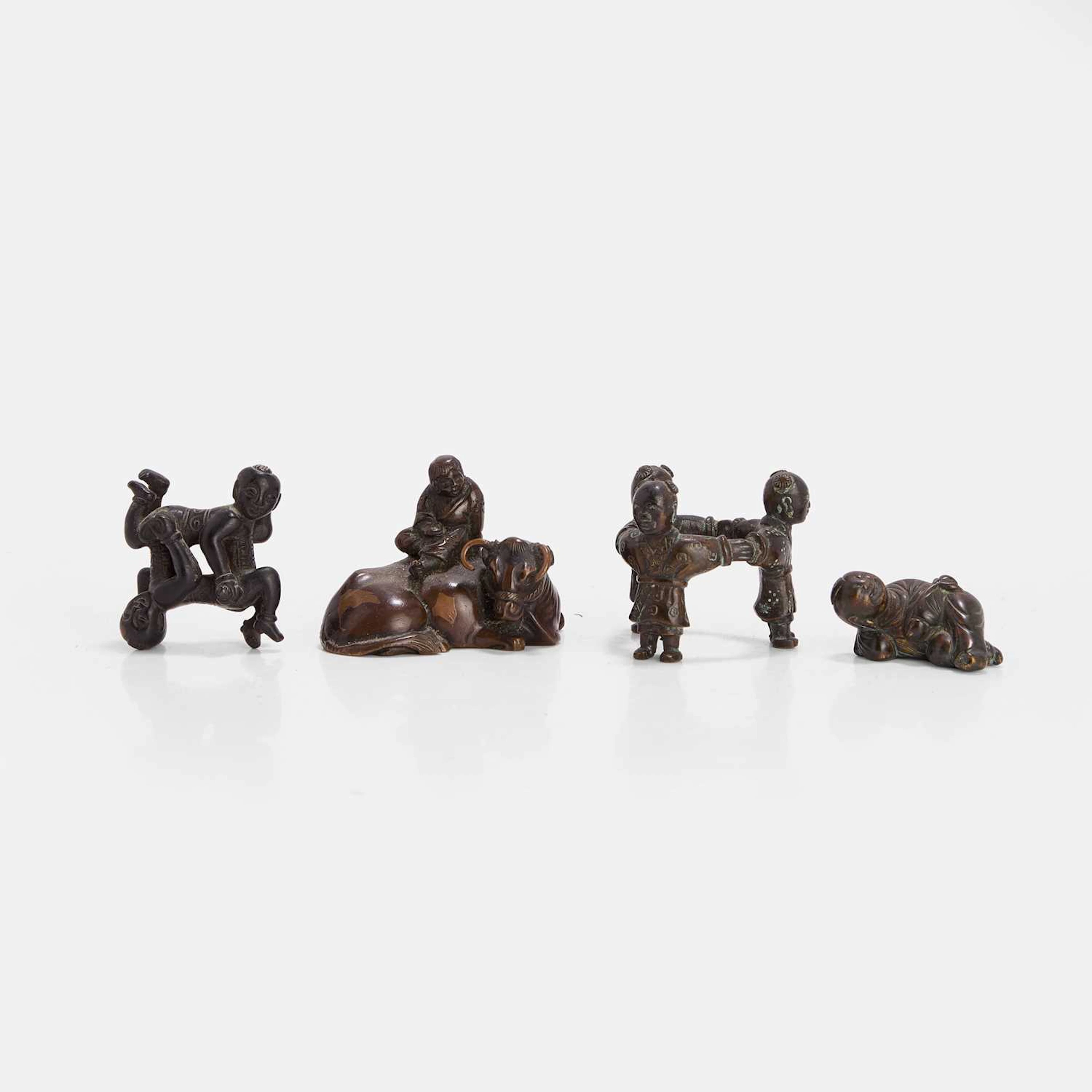 A collection of Chinese and Japanese bronze scroll weights 19th-20th century