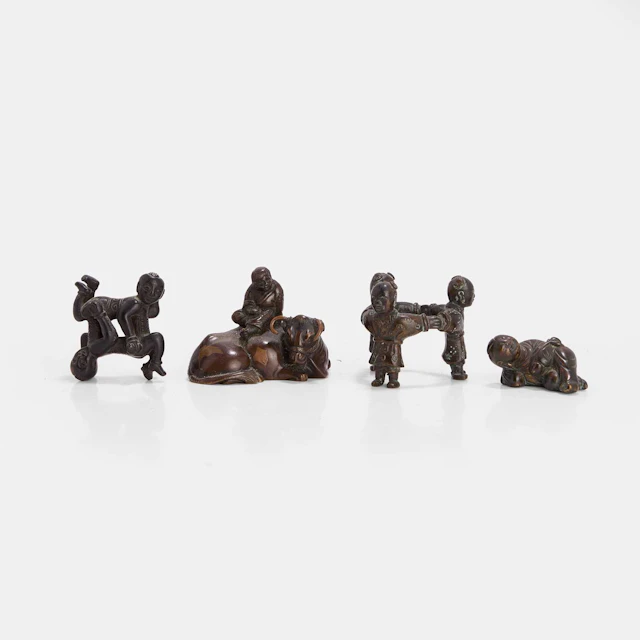 A collection of Chinese and Japanese bronze scroll weights 19th-20th century