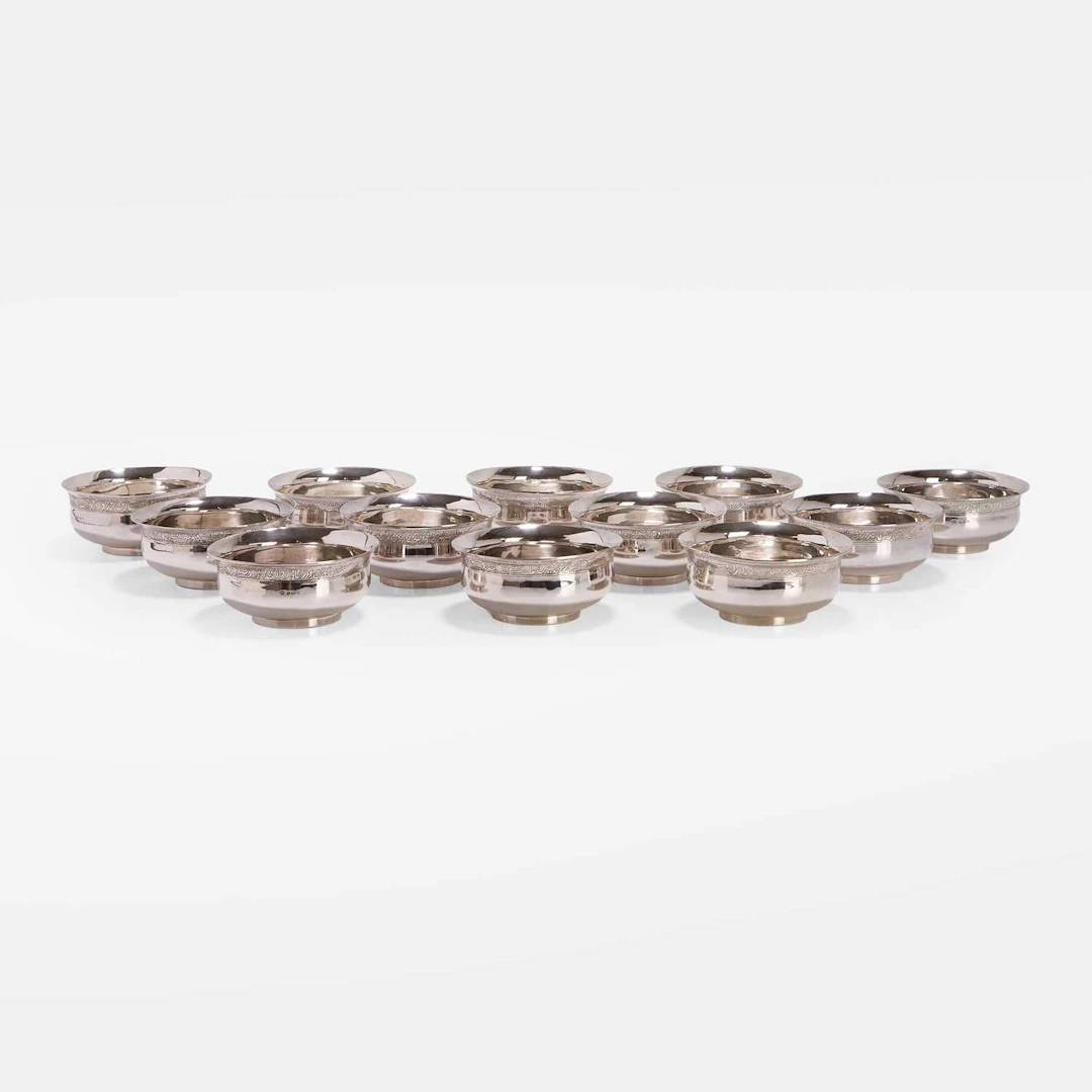 A collection of twelve Persian silver bowls 20th century, Iran