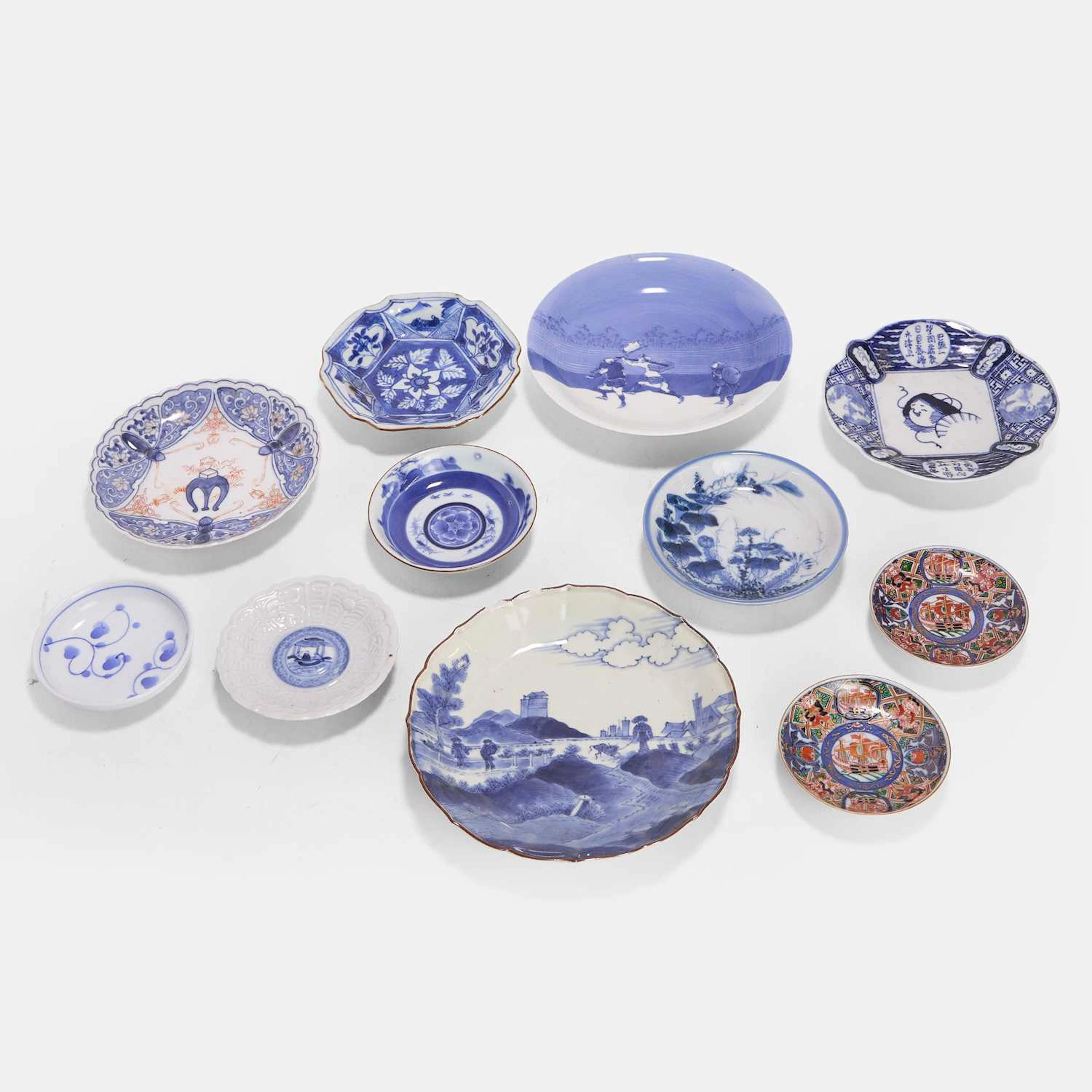 A collection of eleven Japanese porcelain saucers and dishes 19th-20th century